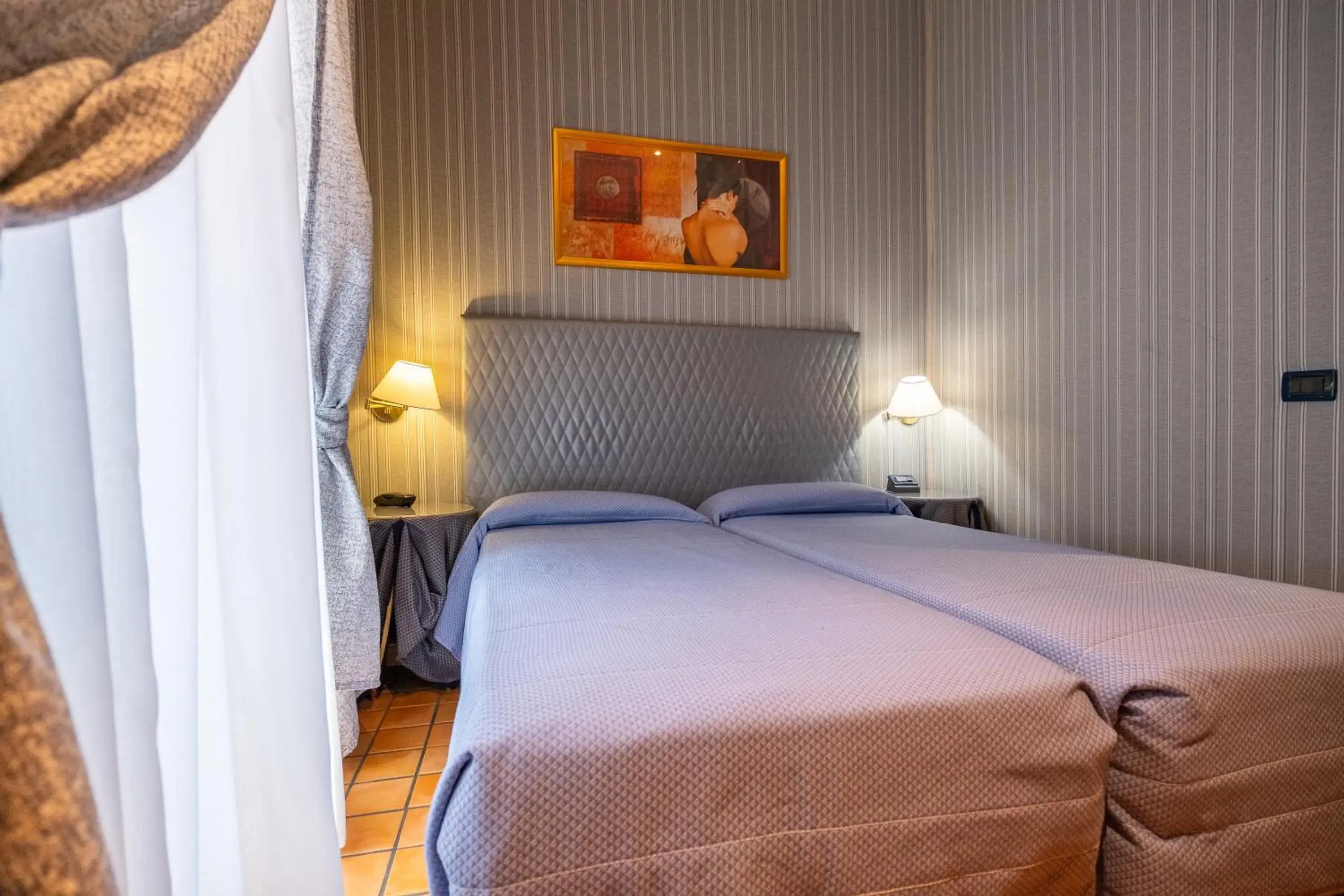 Twin Room in Hotel Lirico Twin Room in Hotel Lirico