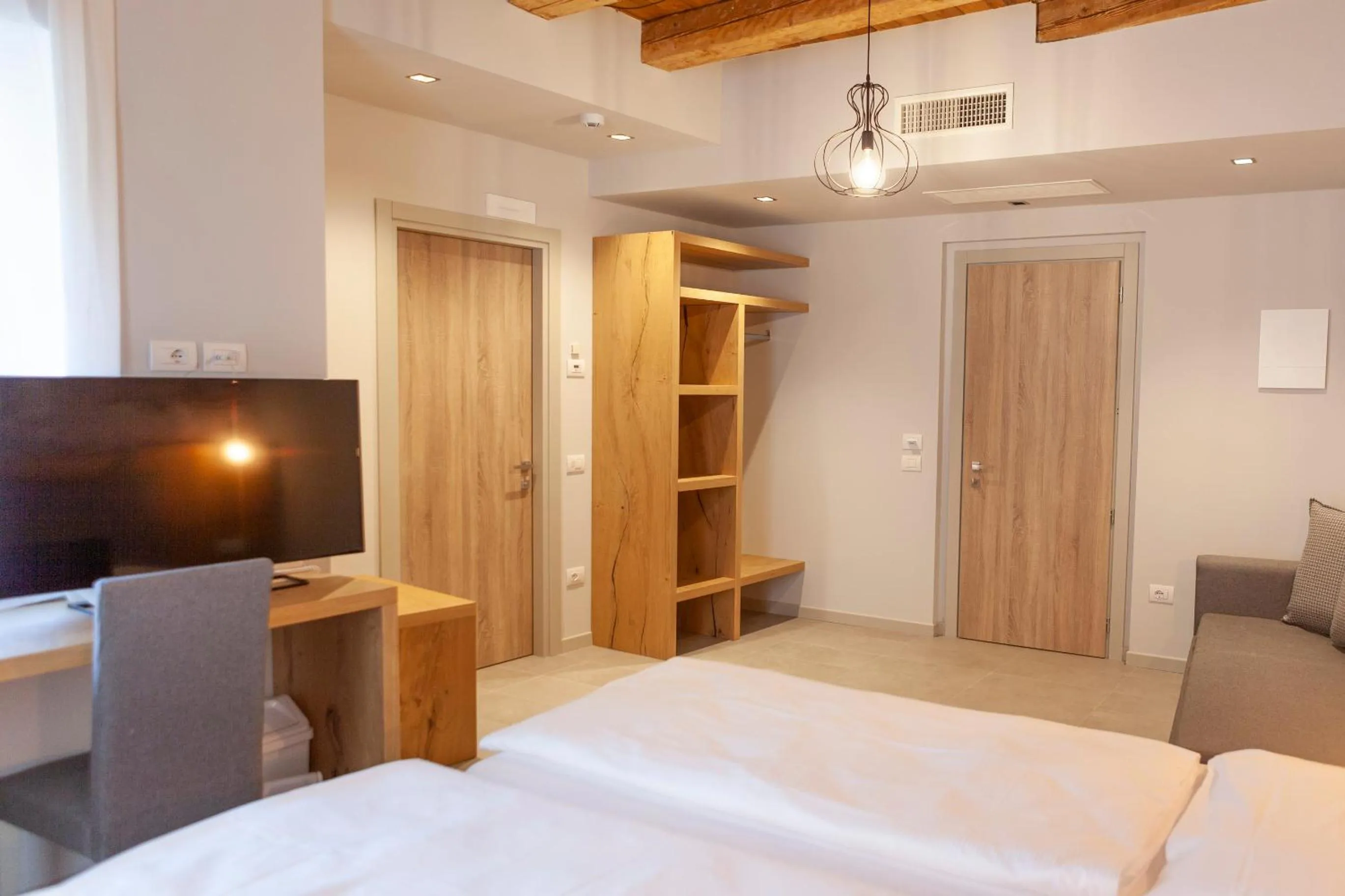 Bed in epOche Hotel Zanella 1889