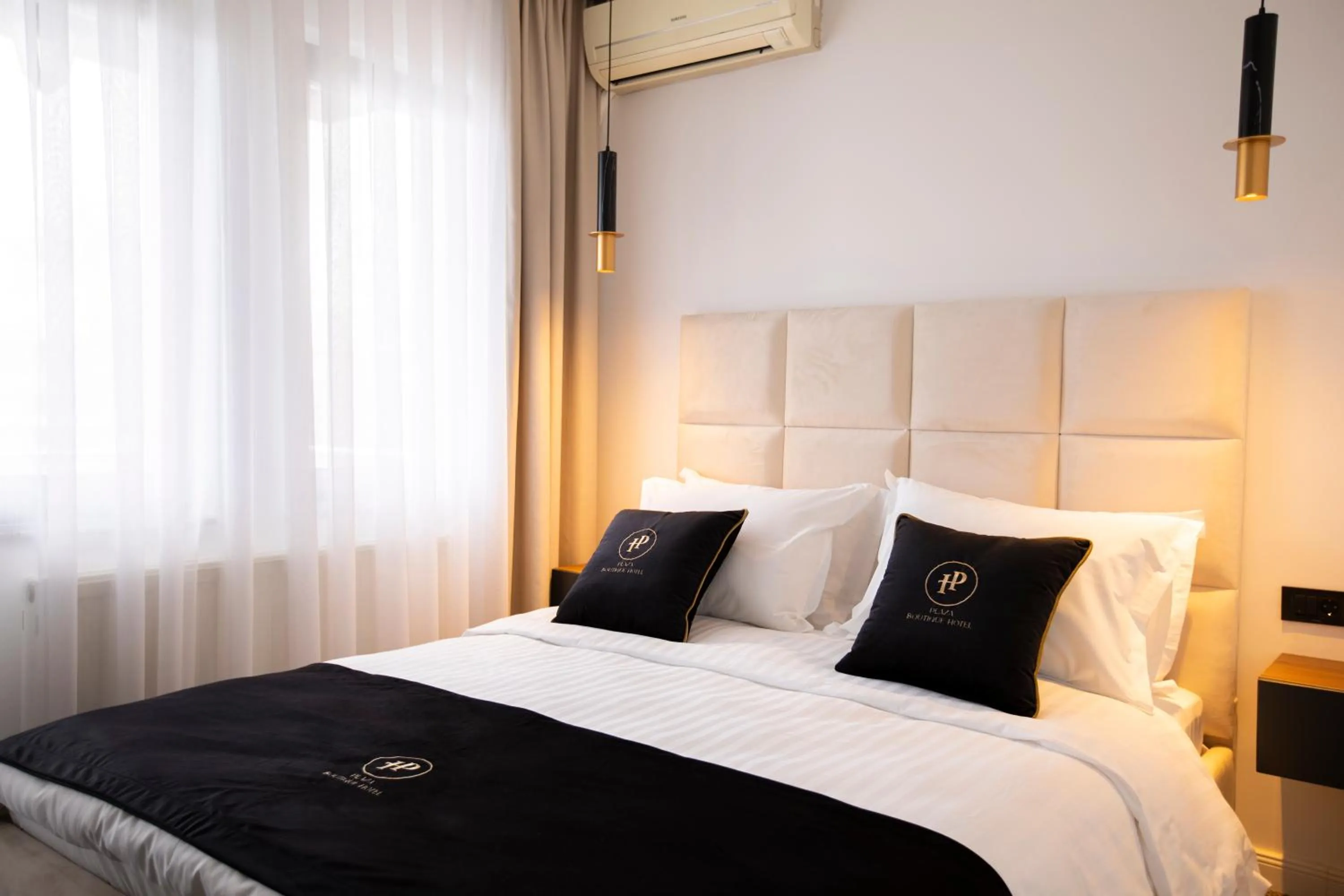 Photo of the whole room, Bed in Plaza Boutique Hotel