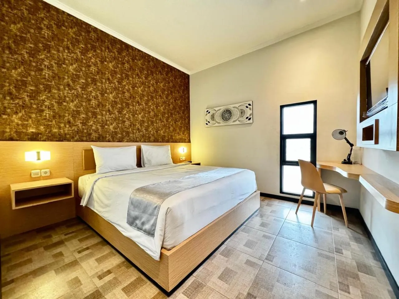 Bed in Grand Plaza Boutique Hotel