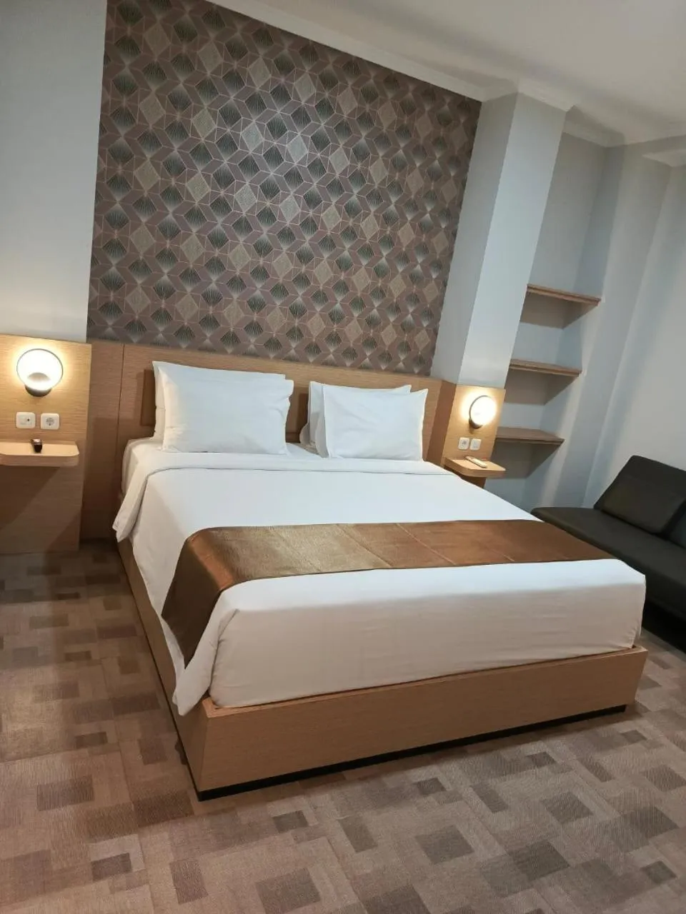 Bed in Grand Plaza Boutique Hotel