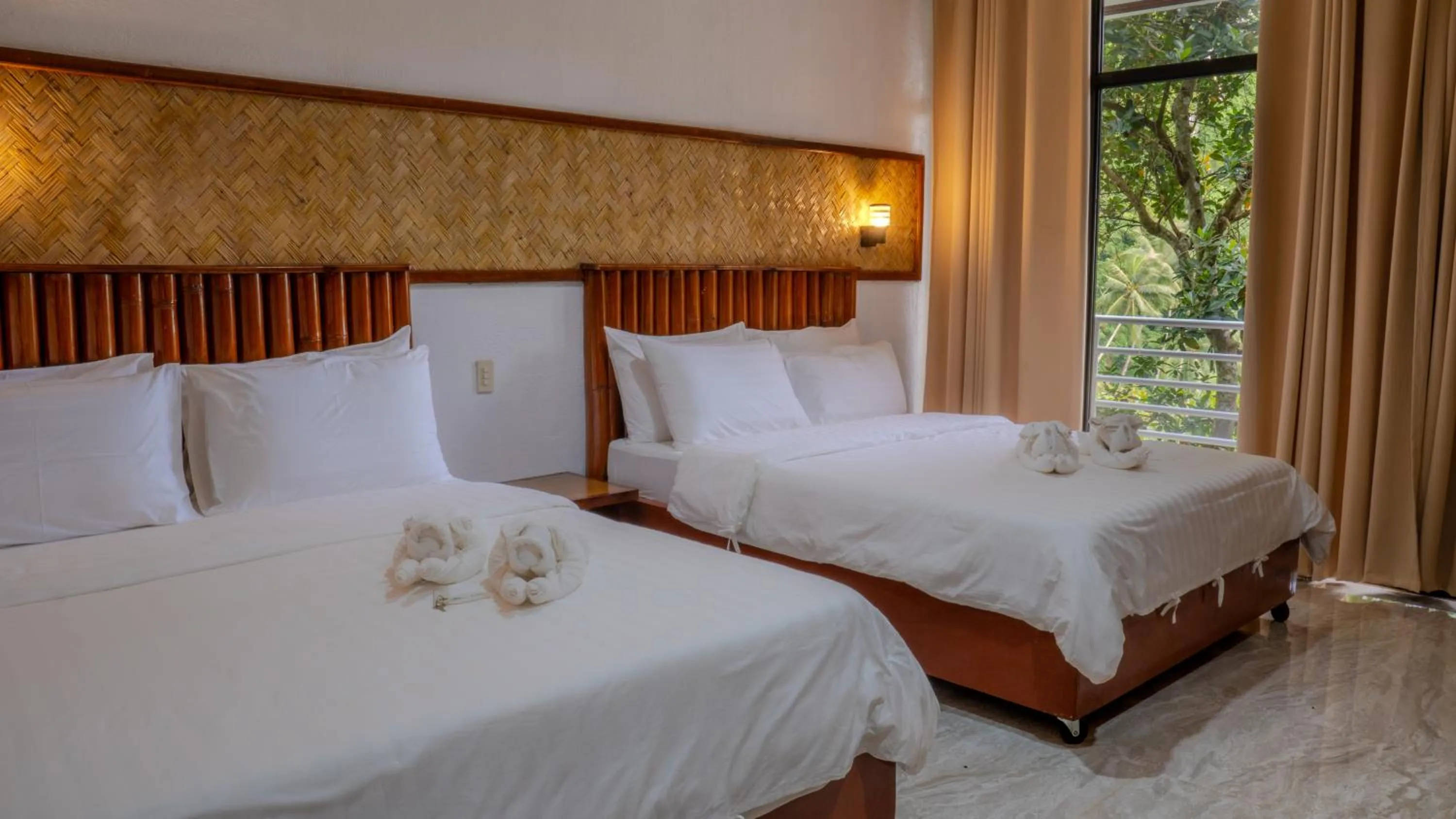 Bed in El Nido Viewdeck Cottages