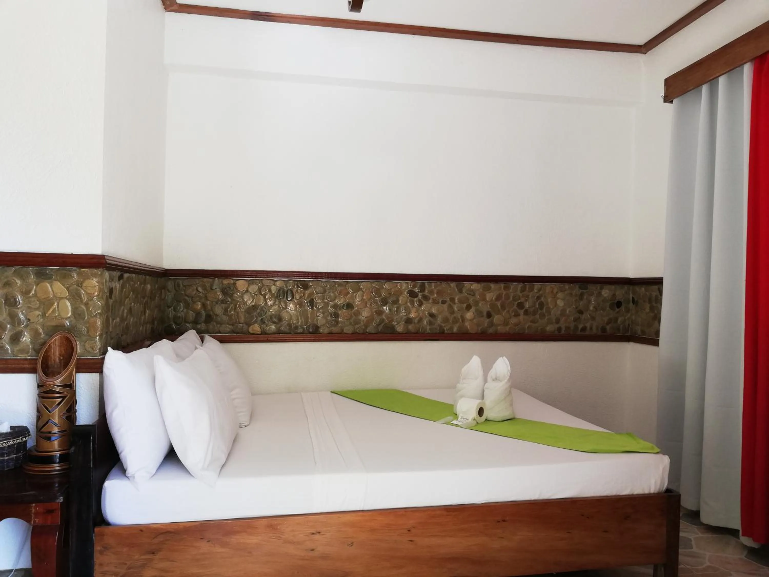 Bed in El Nido Viewdeck Cottages