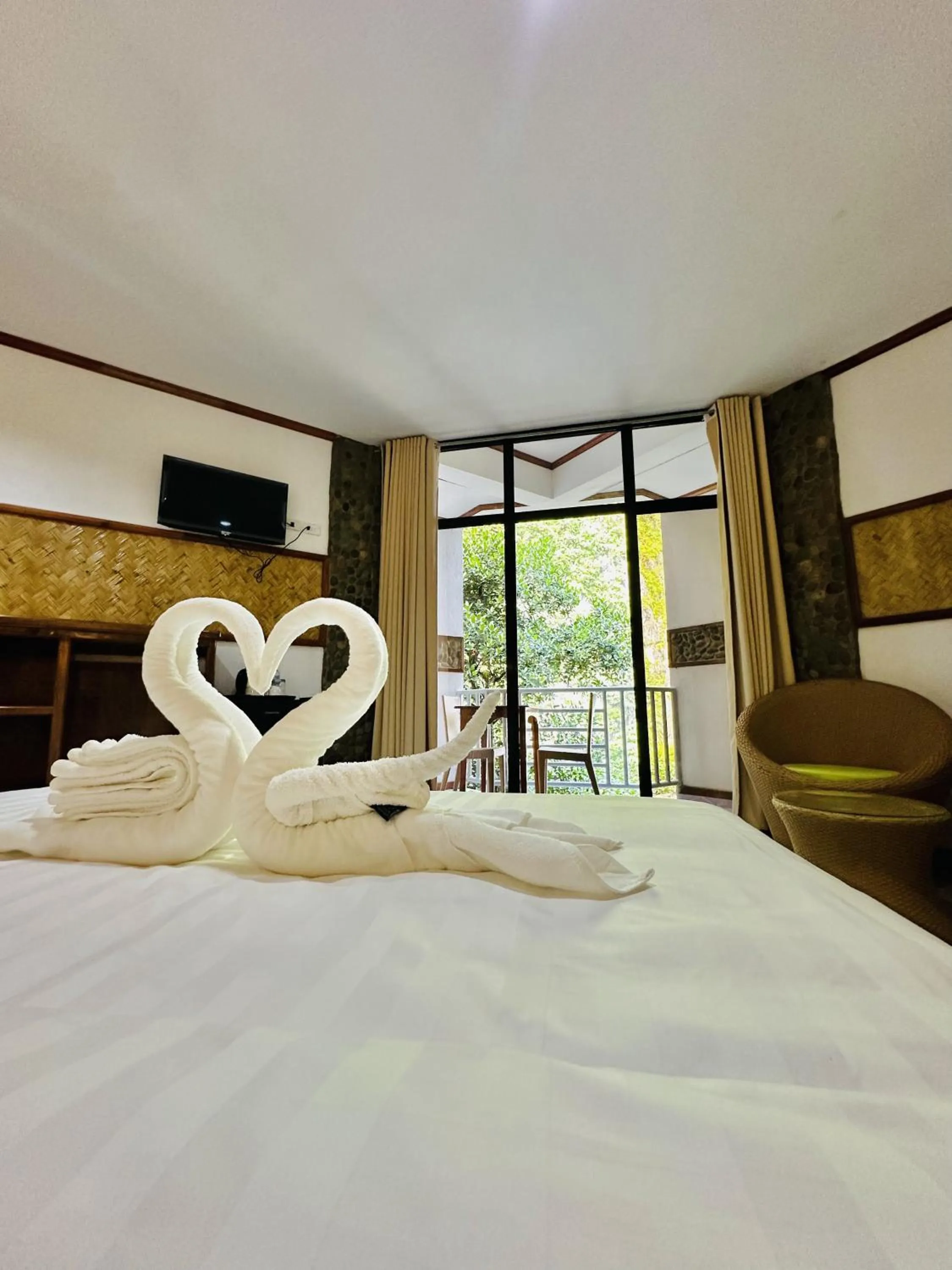 Bed in El Nido Viewdeck Cottages