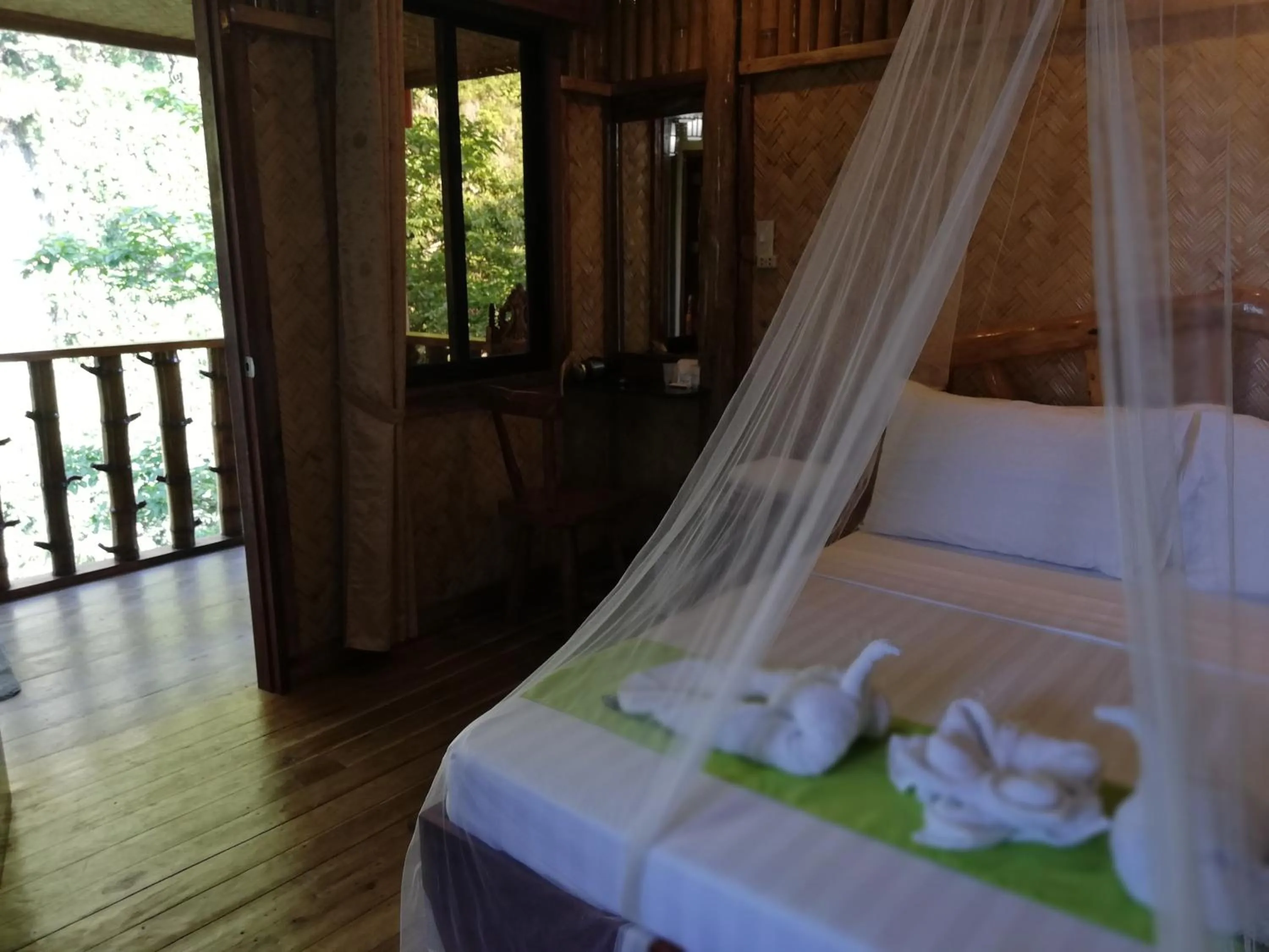 Bed in El Nido Viewdeck Cottages