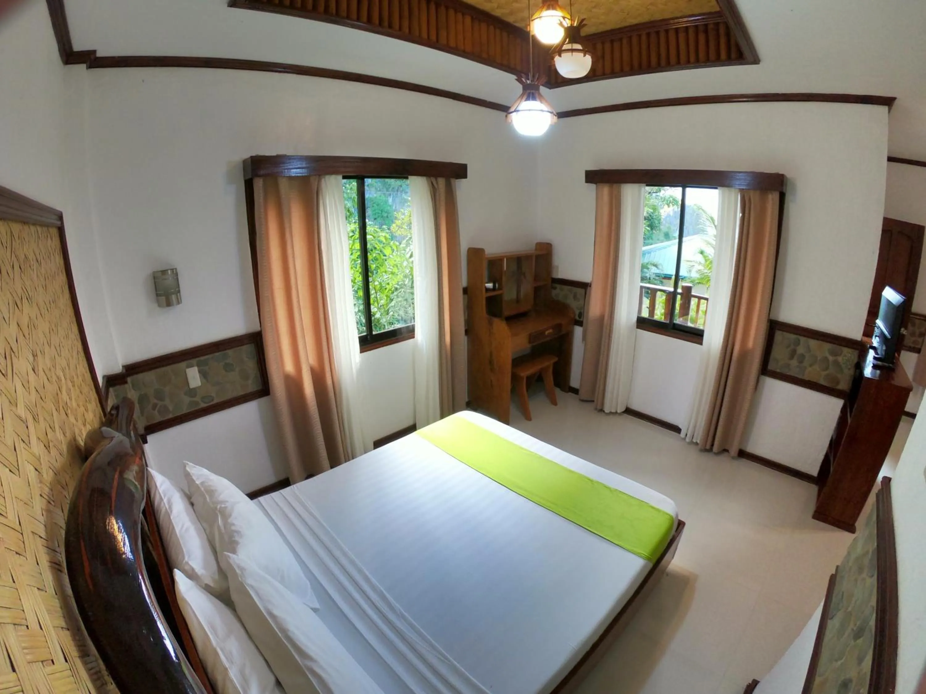 Bed in El Nido Viewdeck Cottages