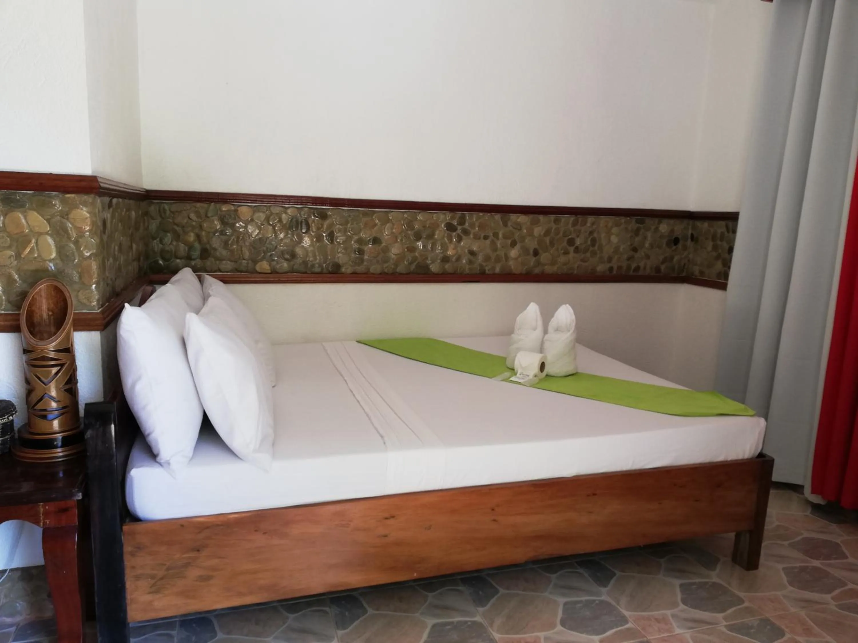 Bed in El Nido Viewdeck Cottages