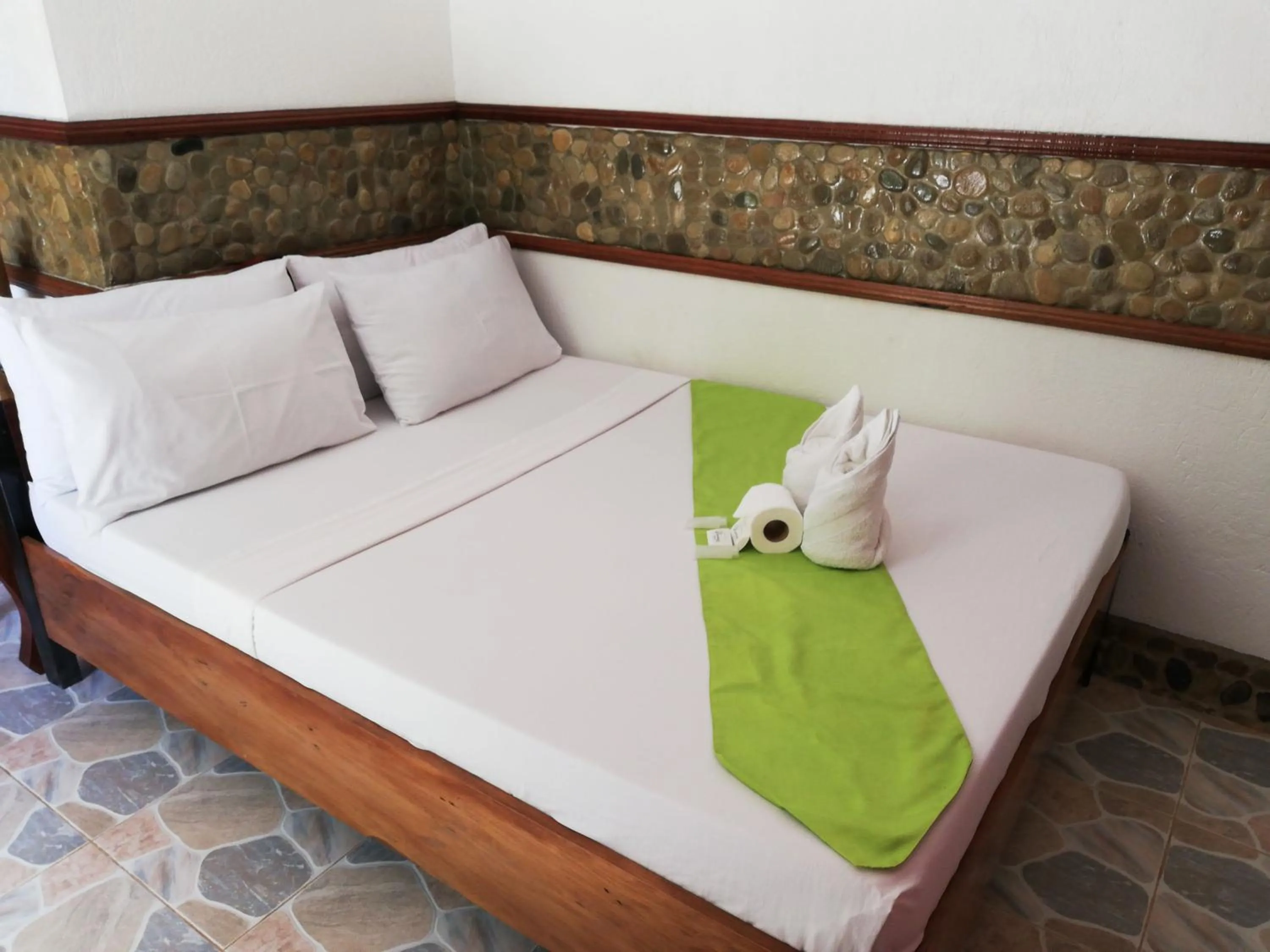 Bed in El Nido Viewdeck Cottages