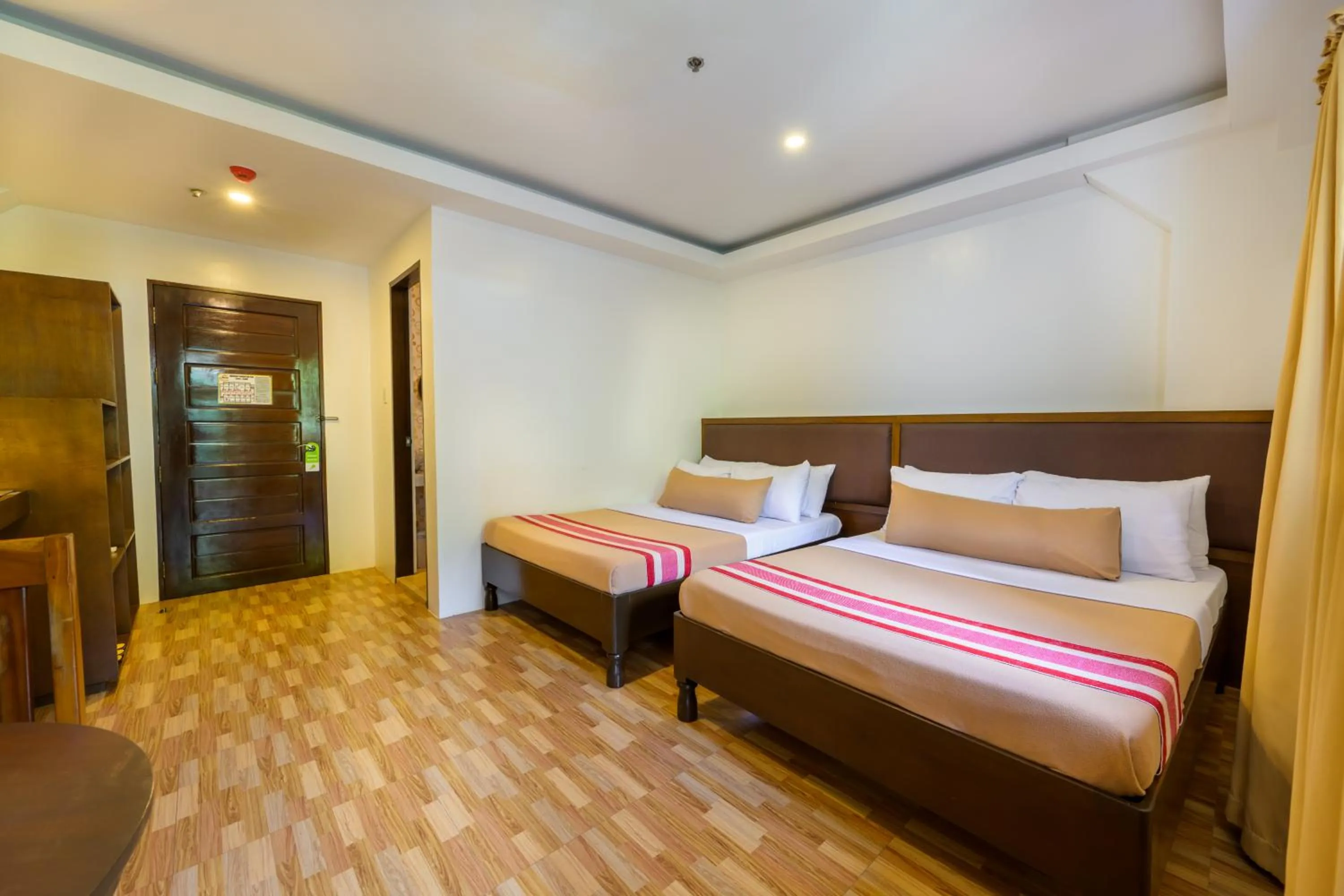 Bed in Jurias Garden Hotel