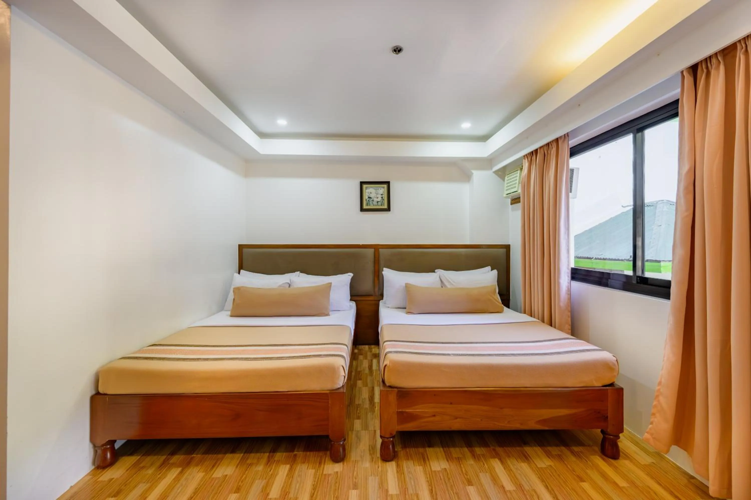 Bed in Jurias Garden Hotel