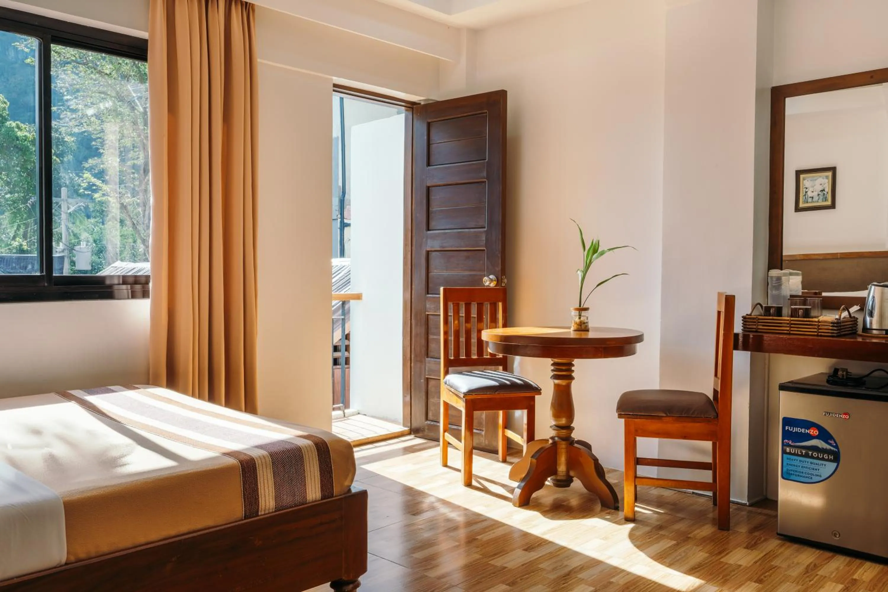 Seating area, Bed in Jurias Garden Hotel