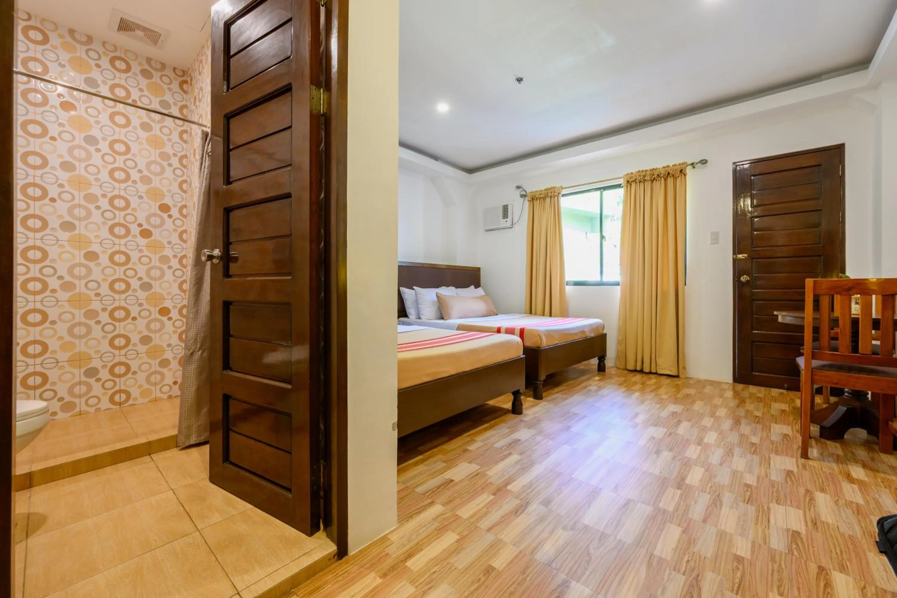 Bed in Jurias Garden Hotel