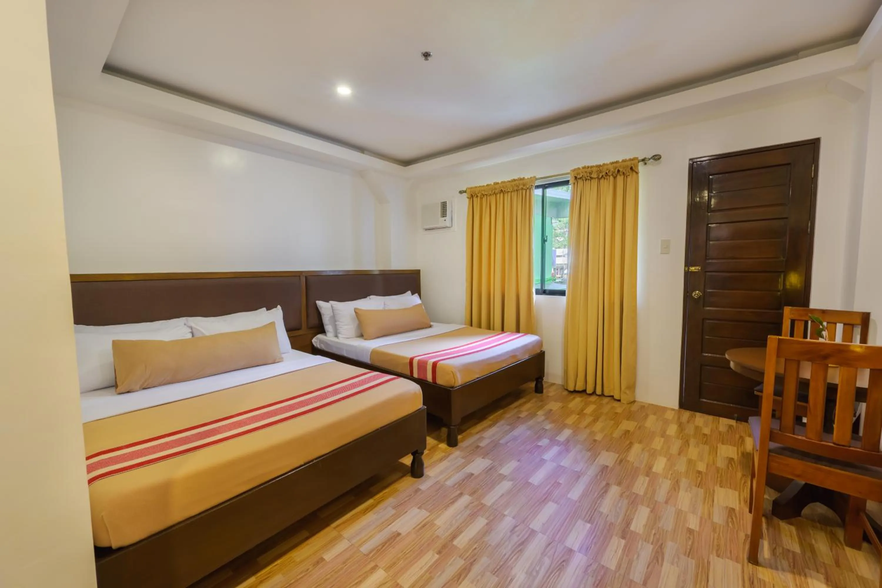 Bed in Jurias Garden Hotel