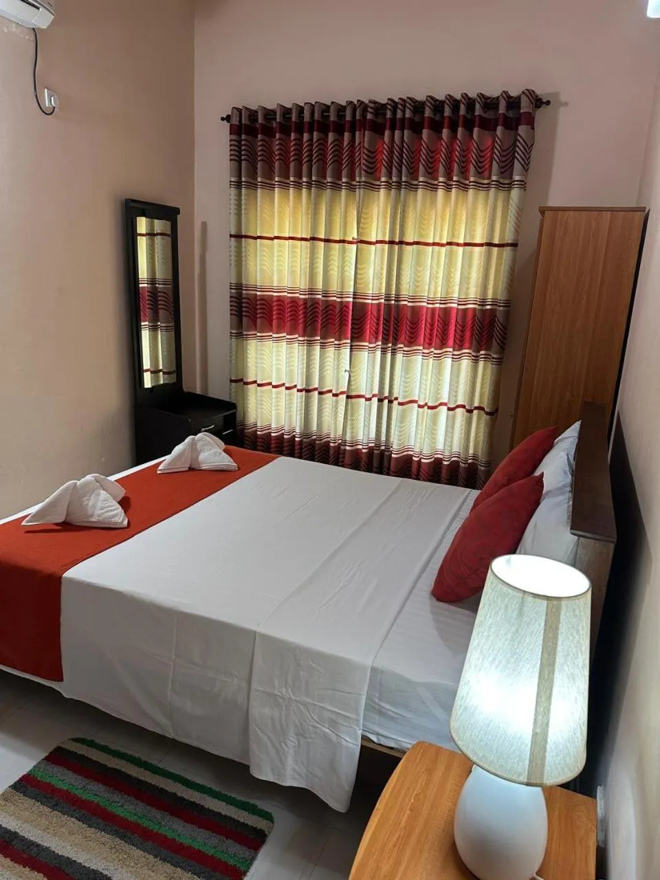 Bed in Lahiru Airport Villa