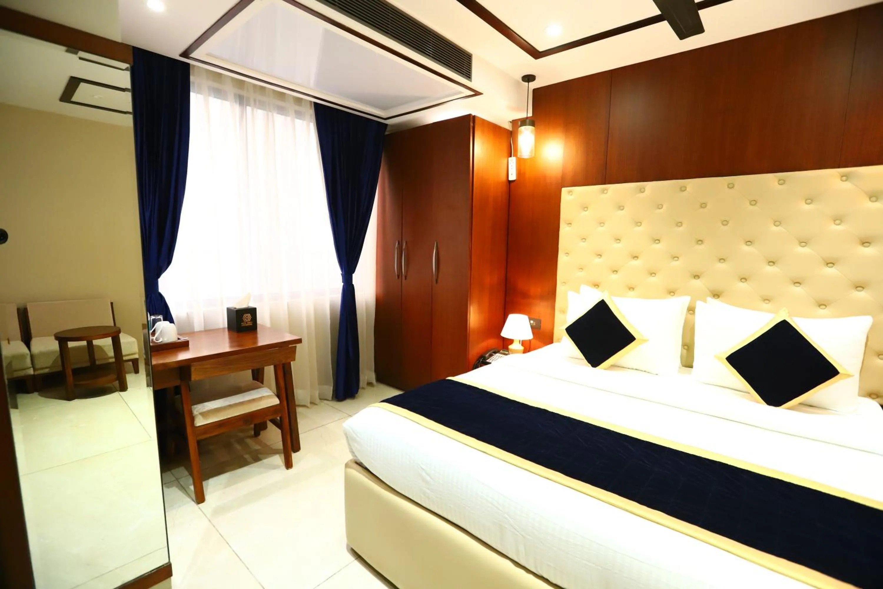 Photo of the whole room, Bed in Sanca International Hotel in Patel Nagar Delhi