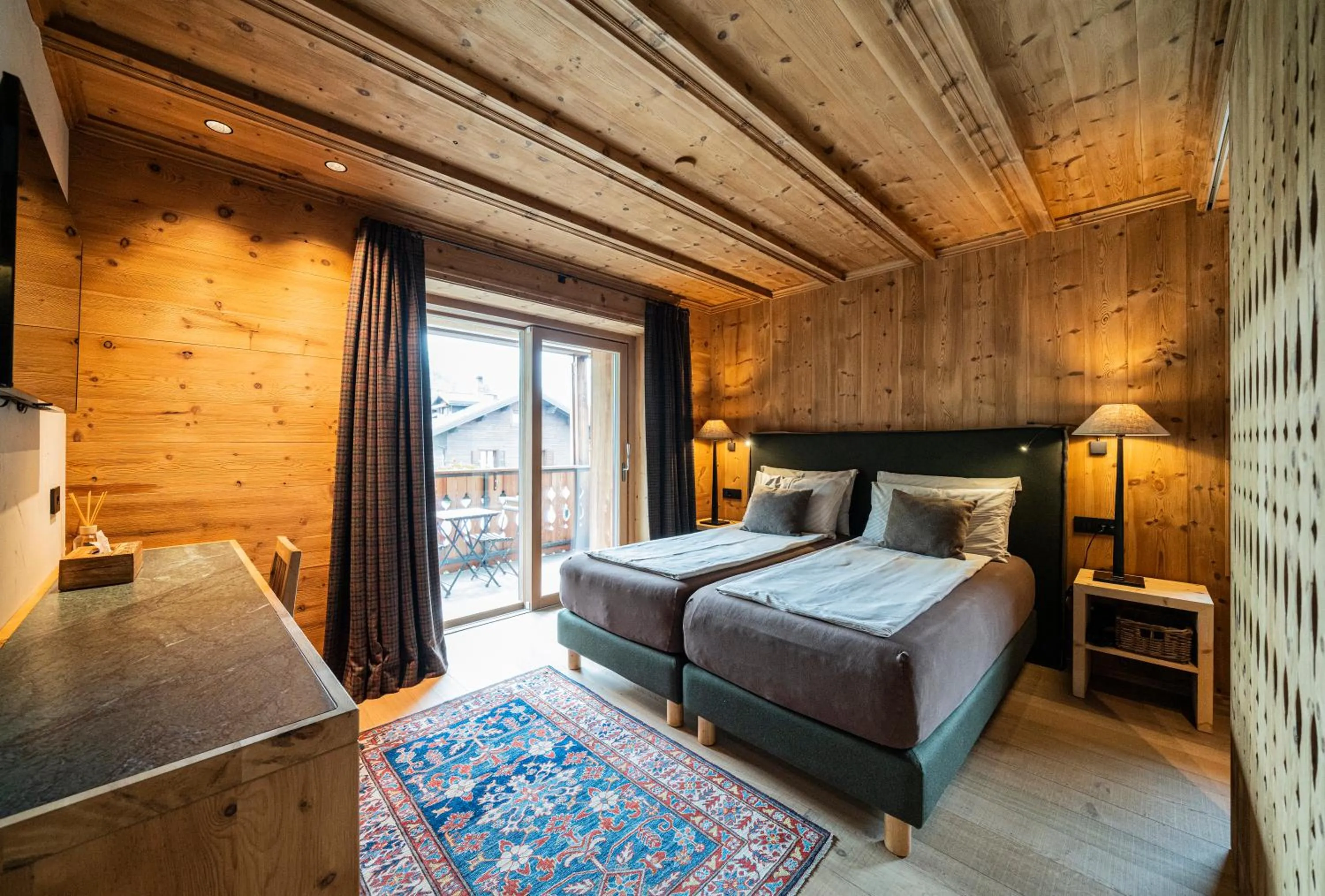 Photo of the whole room, Bed in La Genzianella Bormio