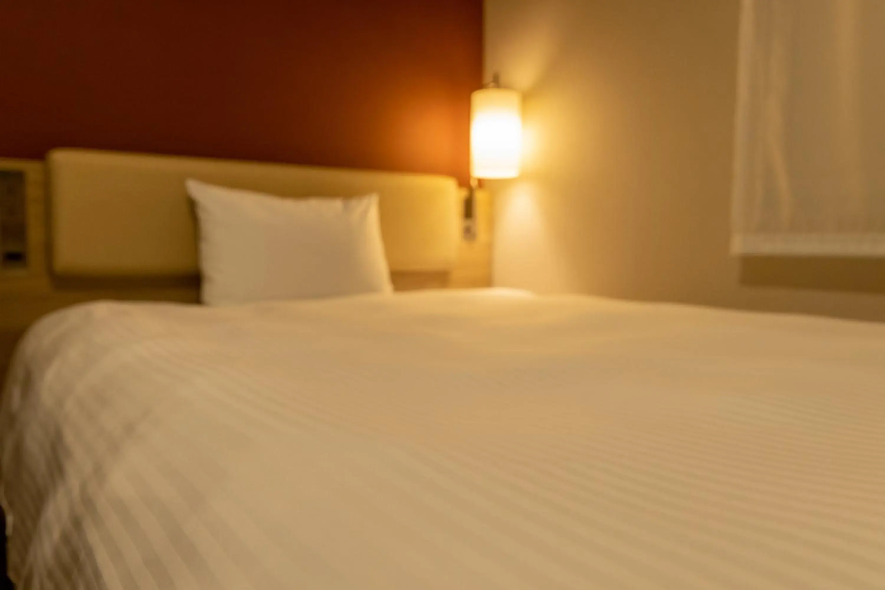 Bed in KEIKYU EX INN Keikyu Kawasaki-Station Bed in KEIKYU EX INN Keikyu Kawasaki-Station