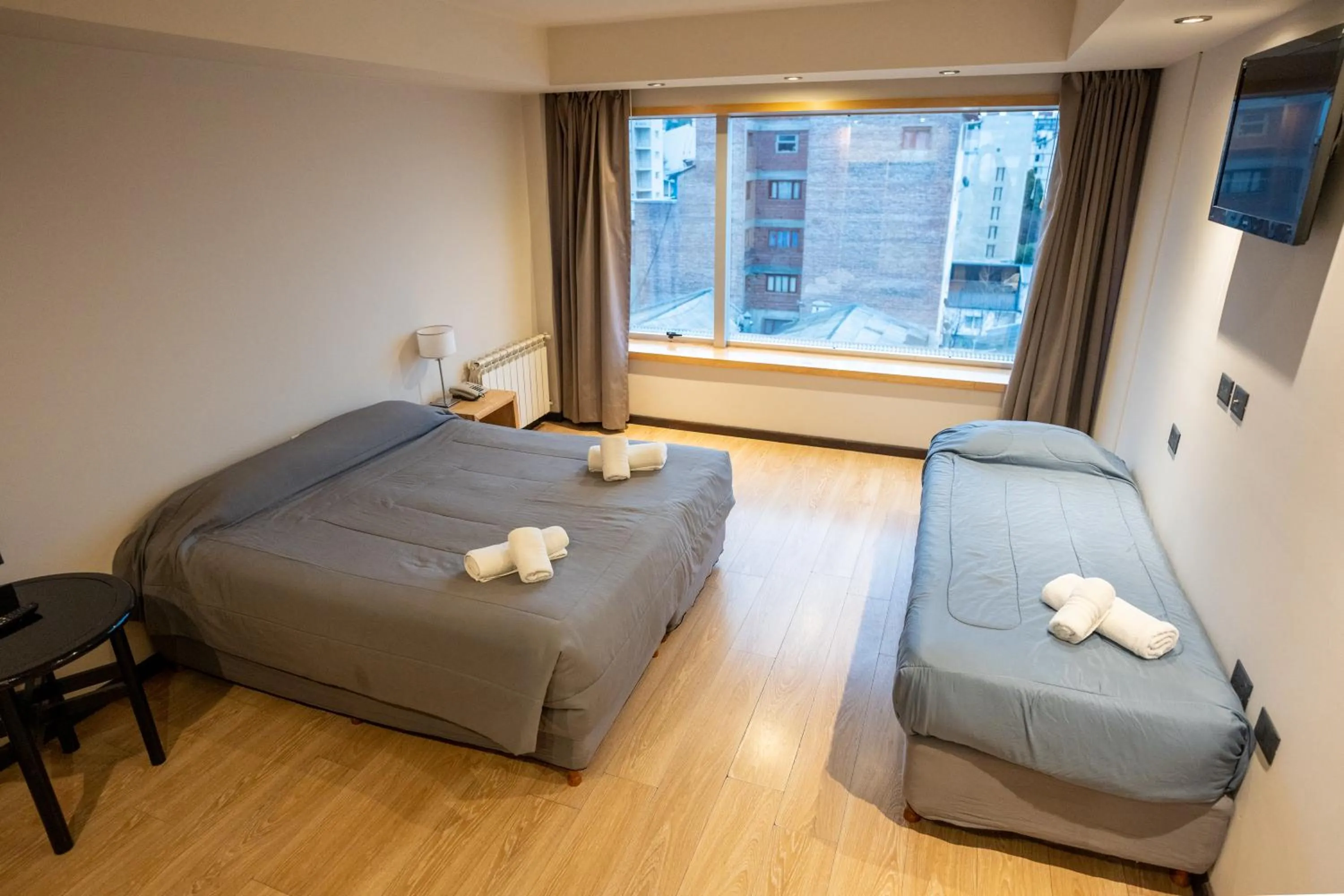 Bed in Hotel Bariloche Suites