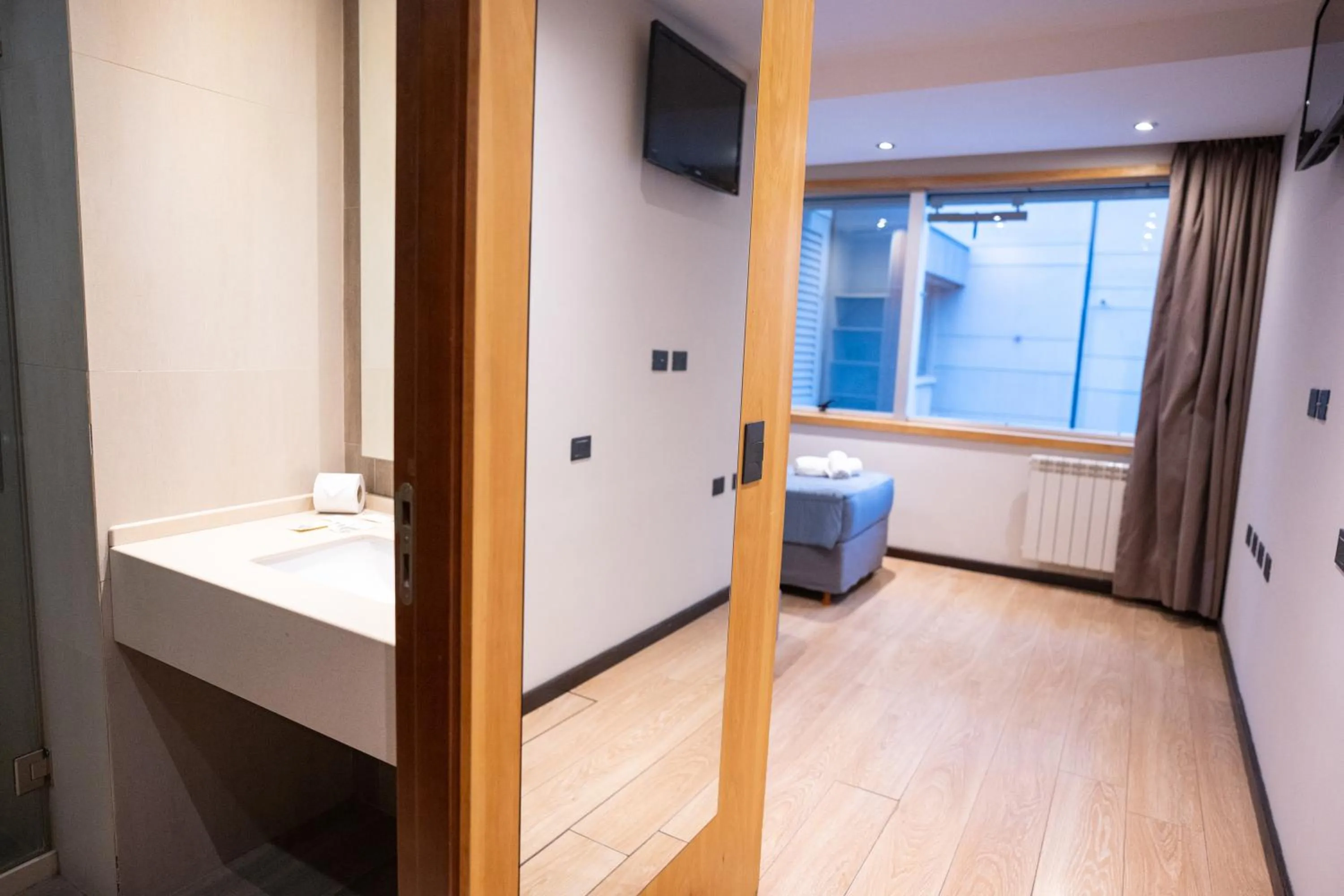 Bed in Hotel Bariloche Suites