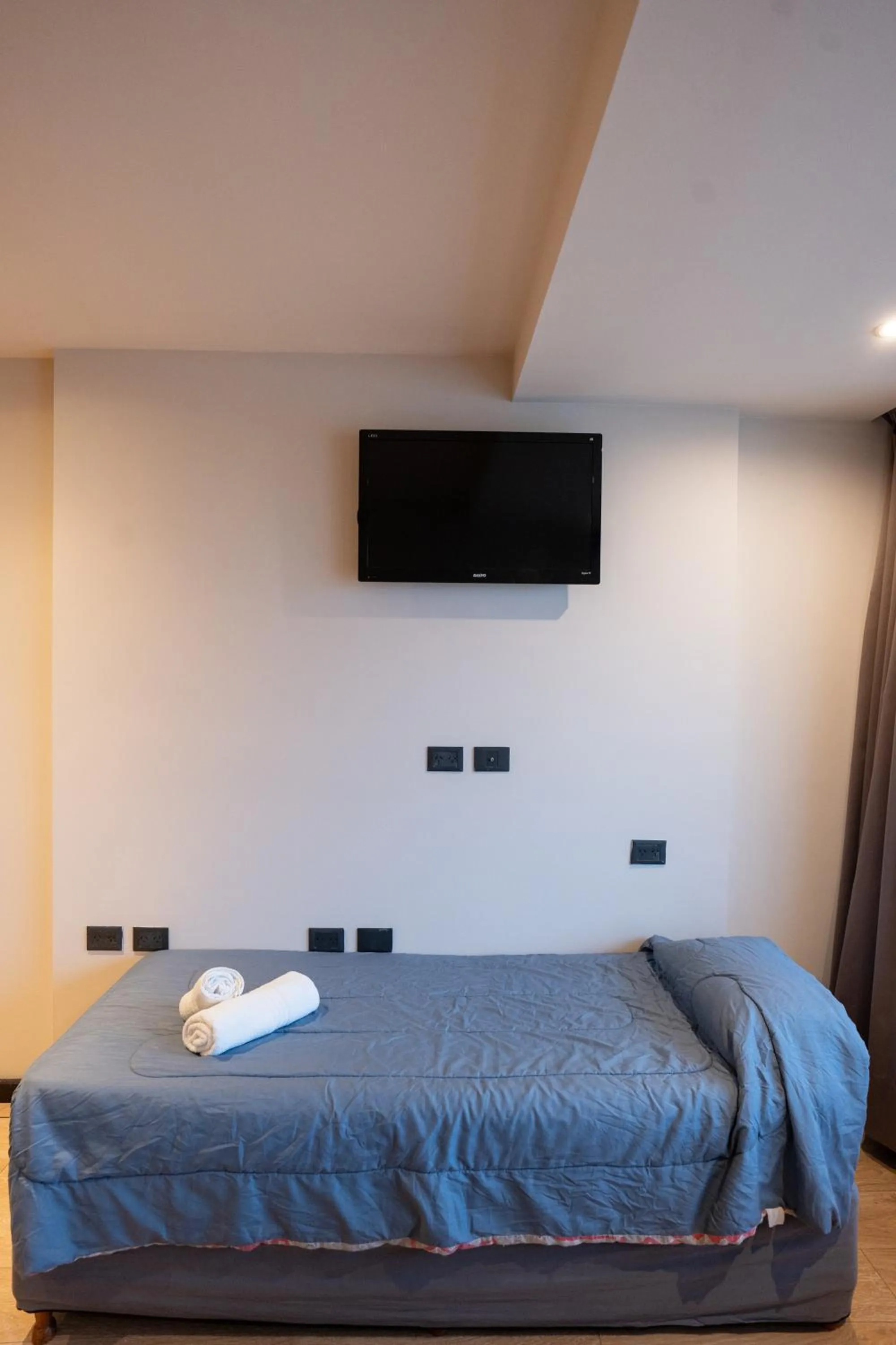 Bed in Hotel Bariloche Suites