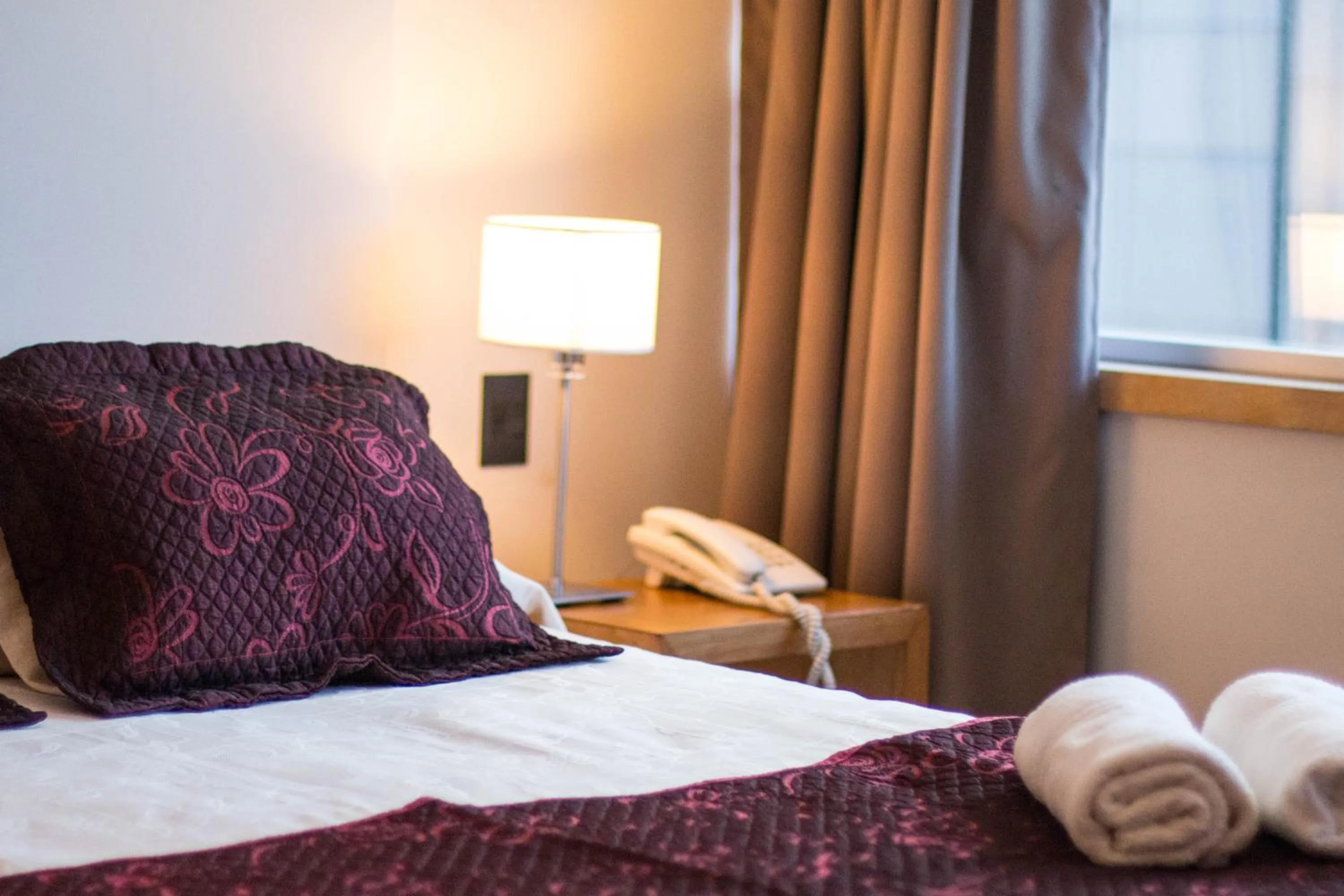 Bed in Hotel Bariloche Suites