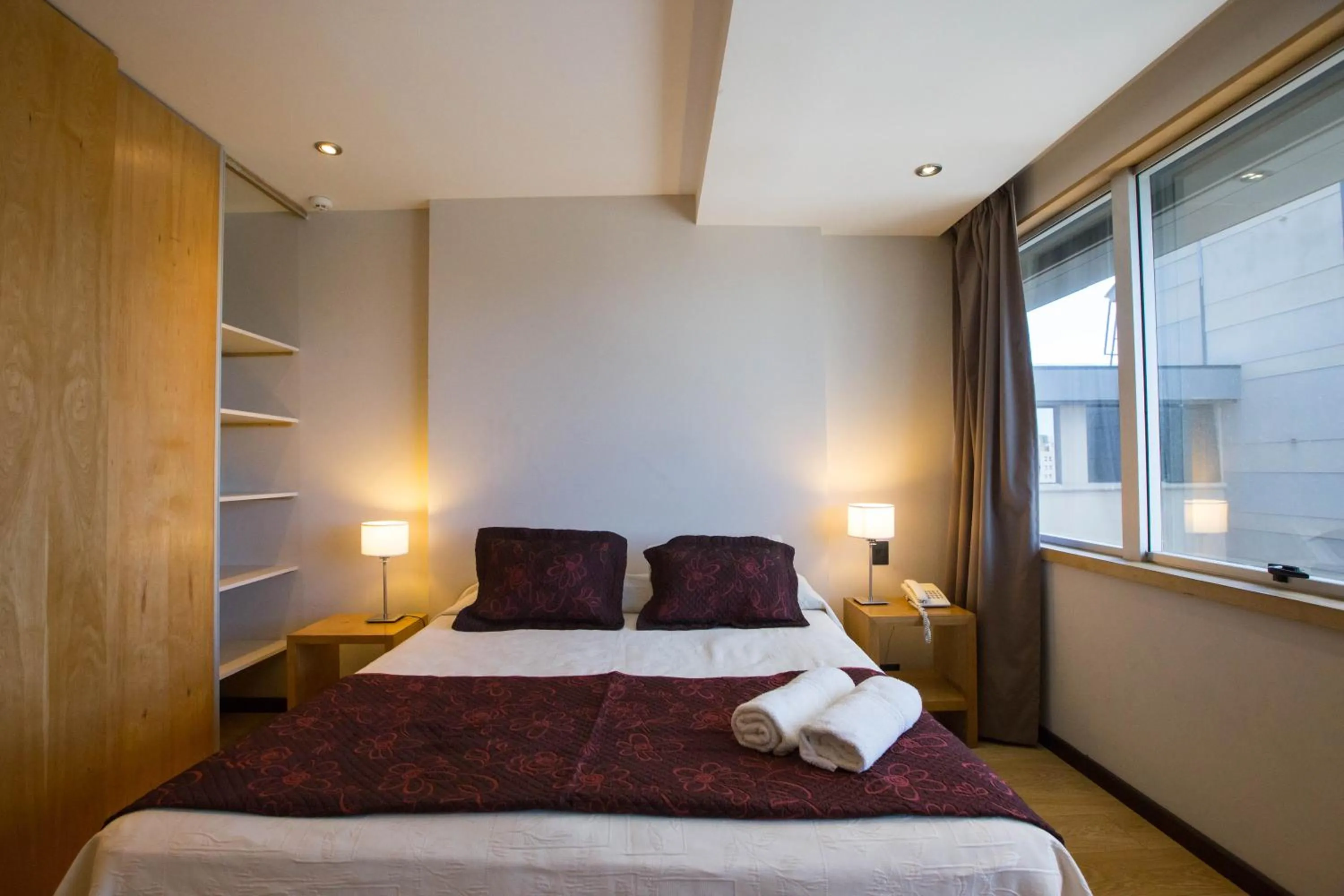 Bed in Hotel Bariloche Suites