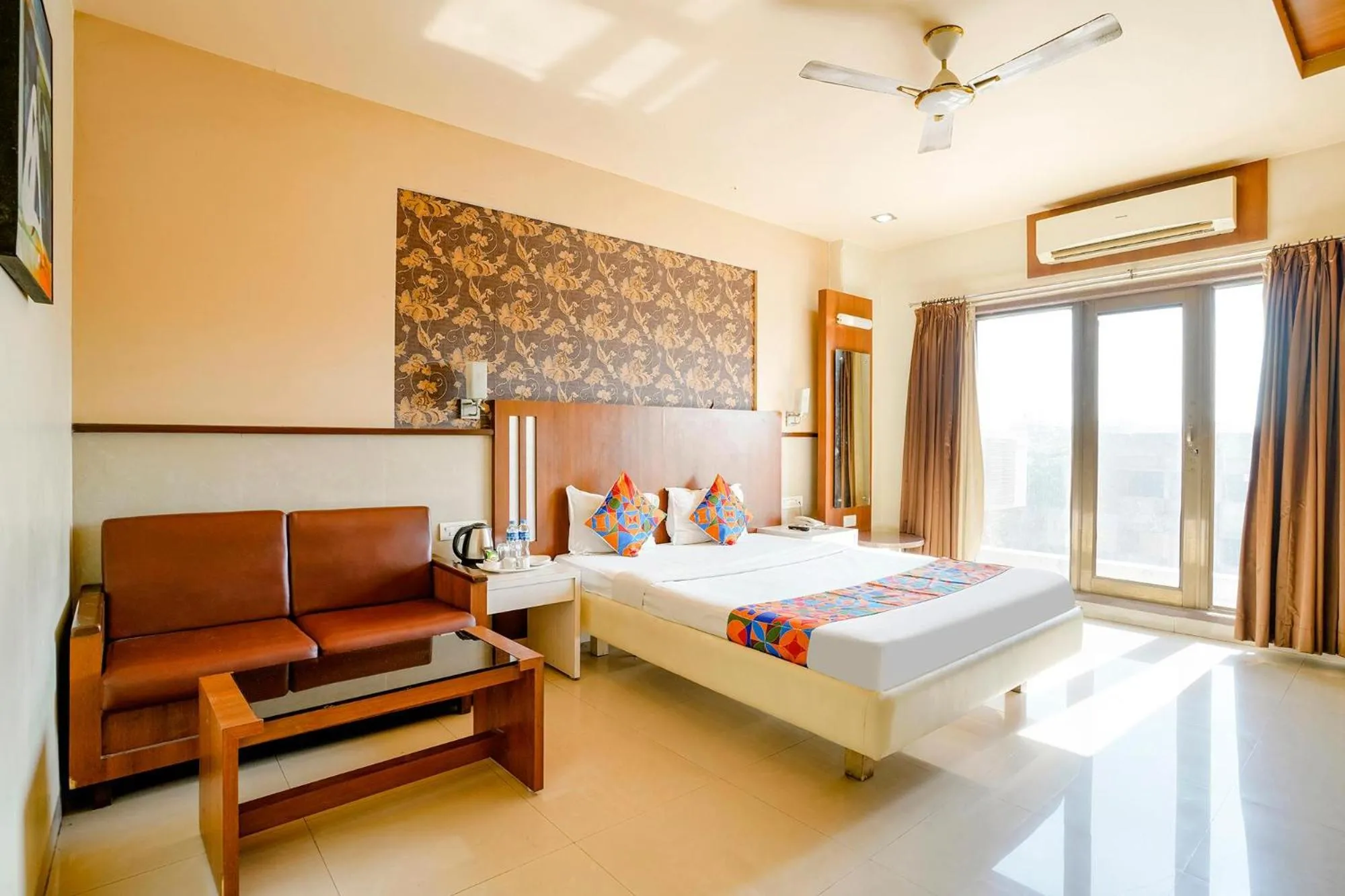 Bed in FabHotel Devanshi Inn