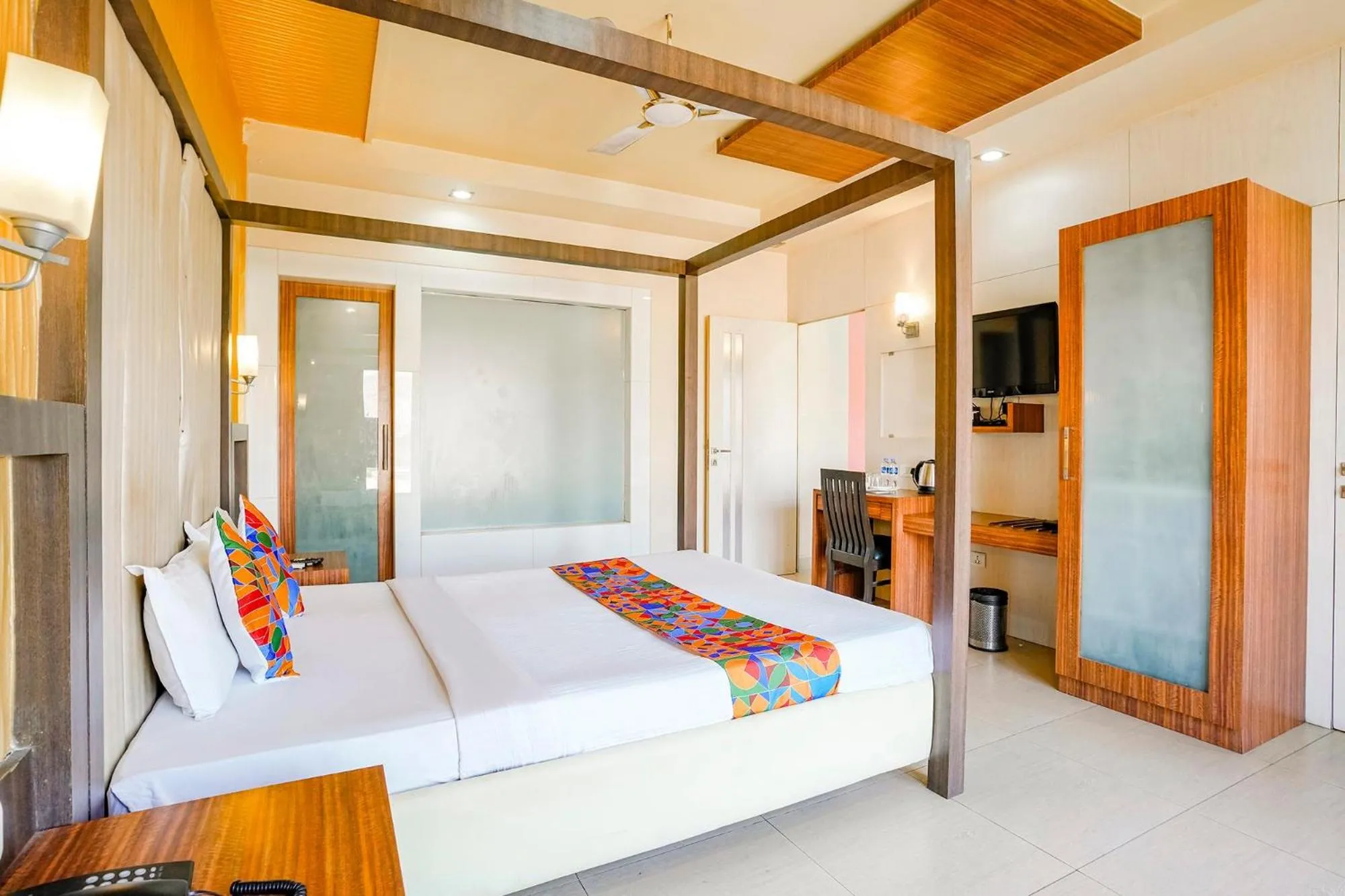 Bed in FabHotel Devanshi Inn