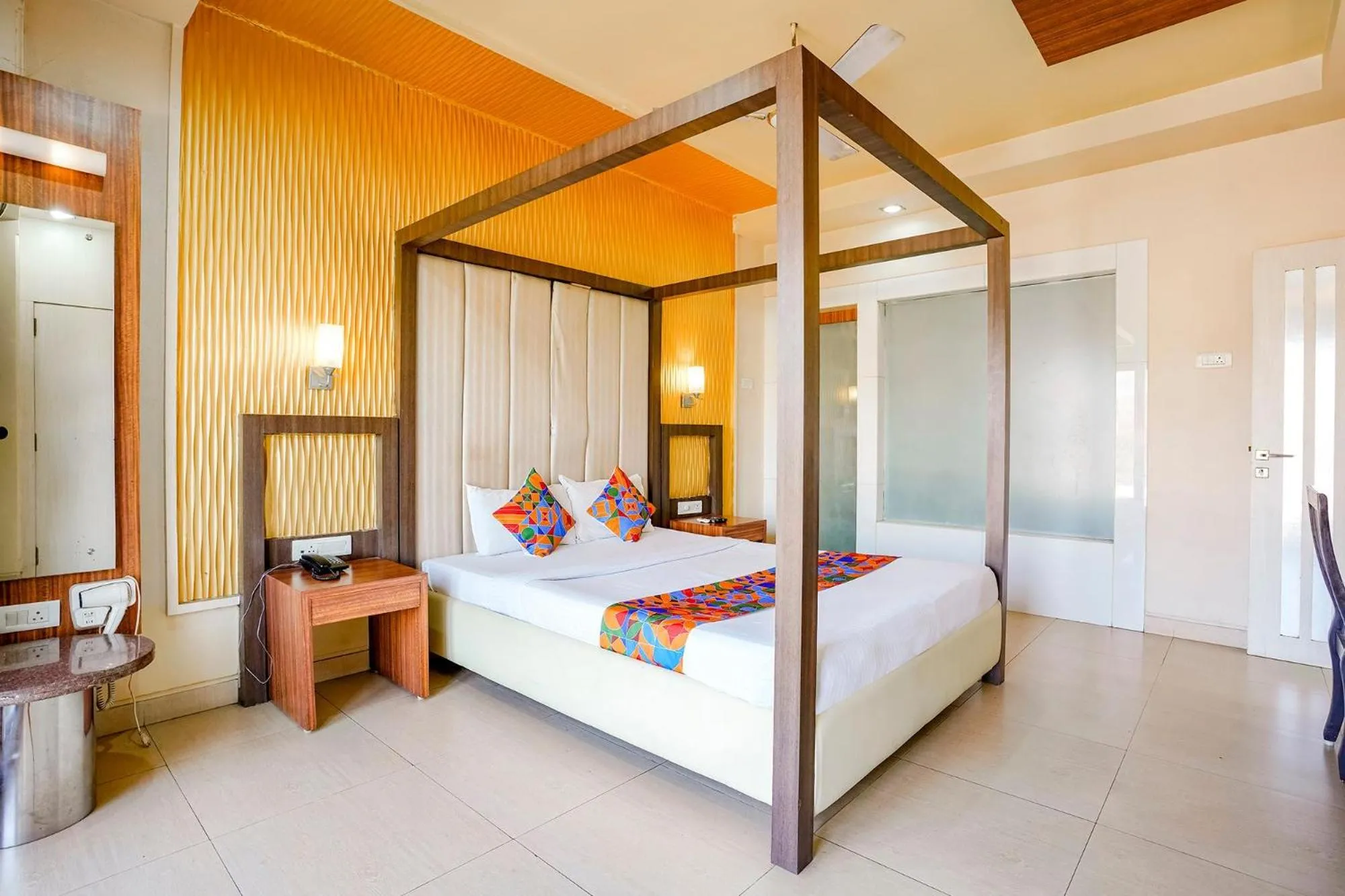 Bed in FabHotel Devanshi Inn