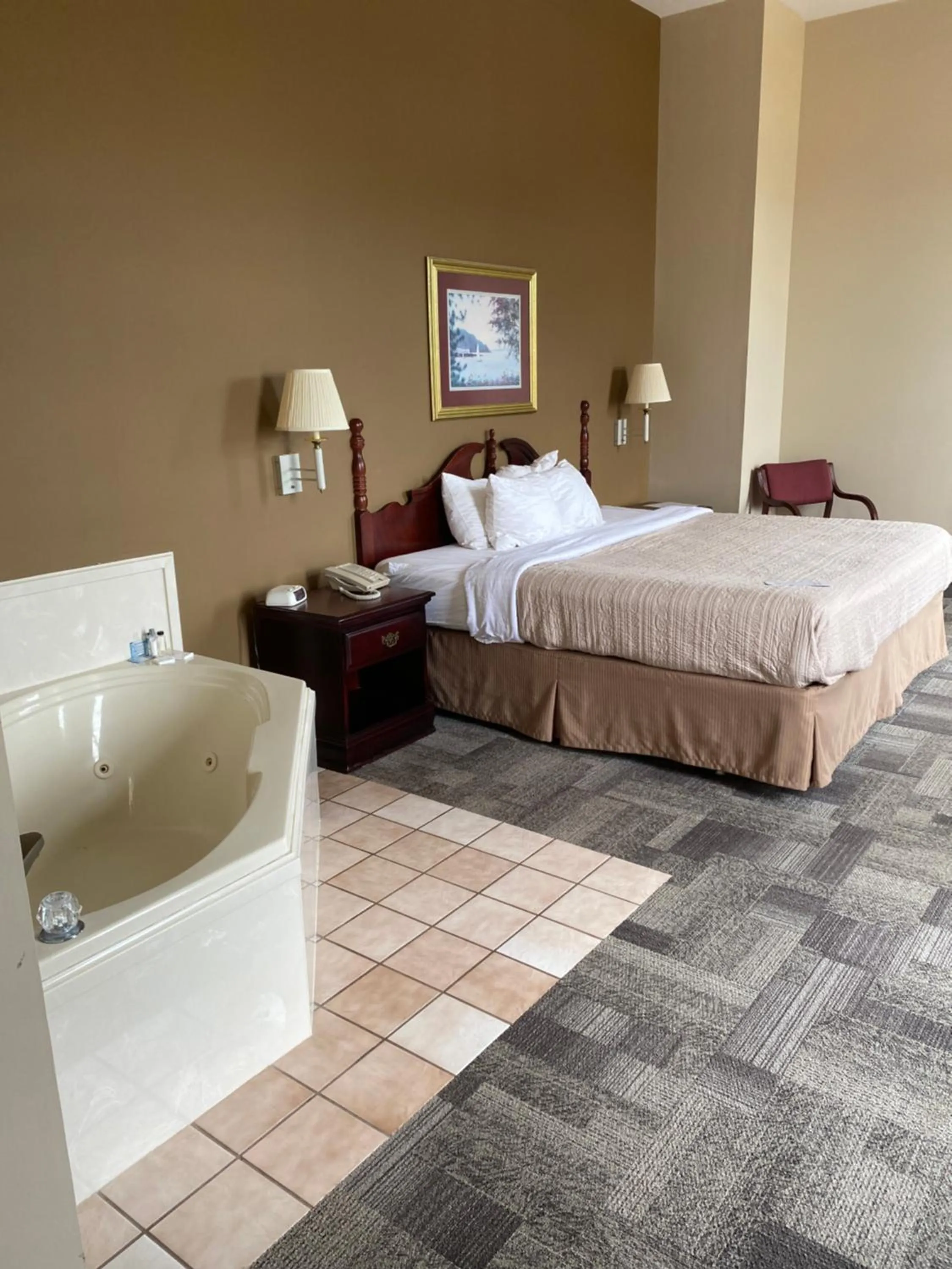 Bed in COLLINS INN & SUITES