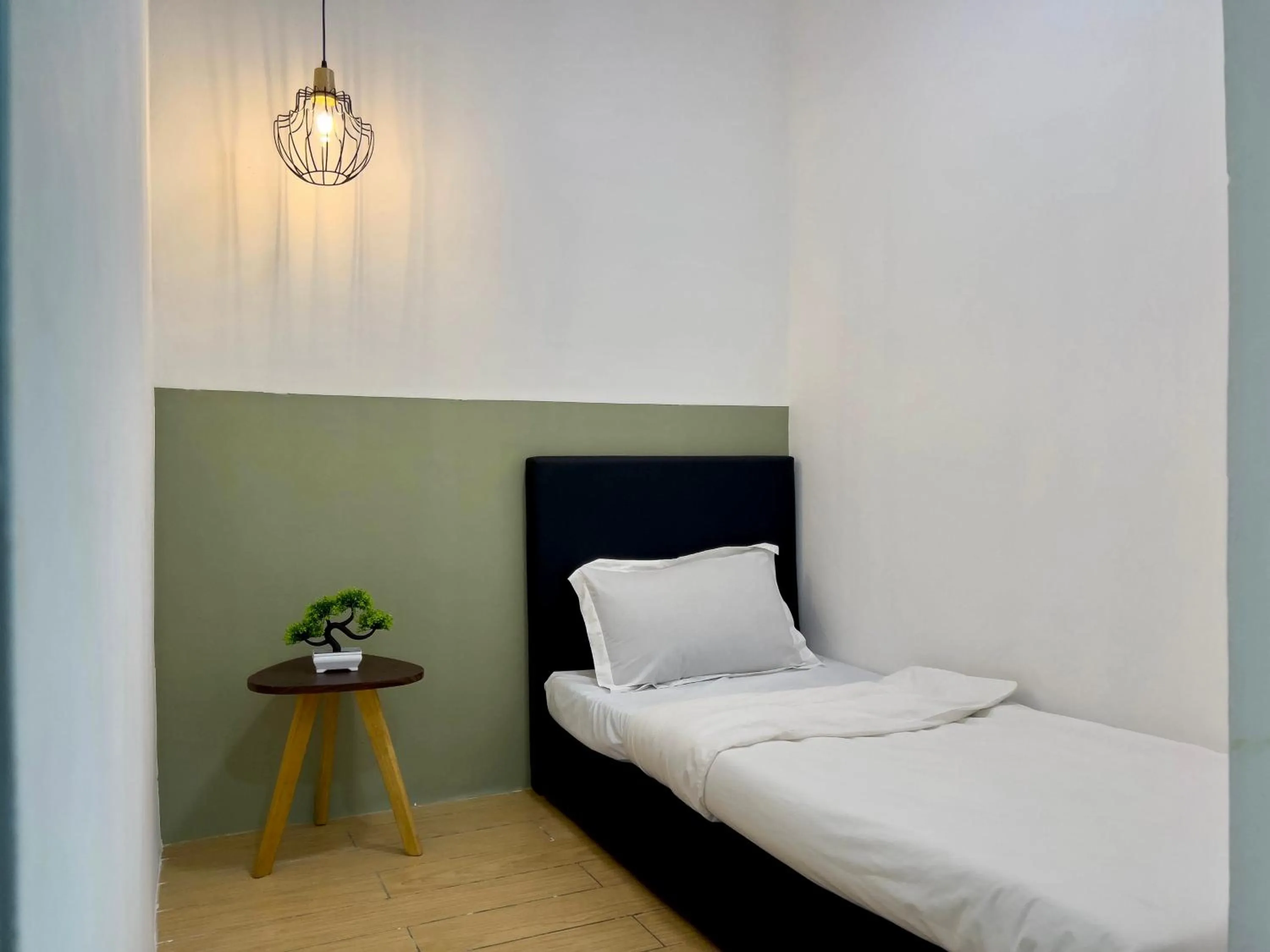 Bed in Hush Inn at ITCC Manhattan Suites