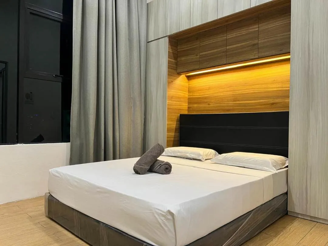 Bed in Hush Inn at ITCC Manhattan Suites