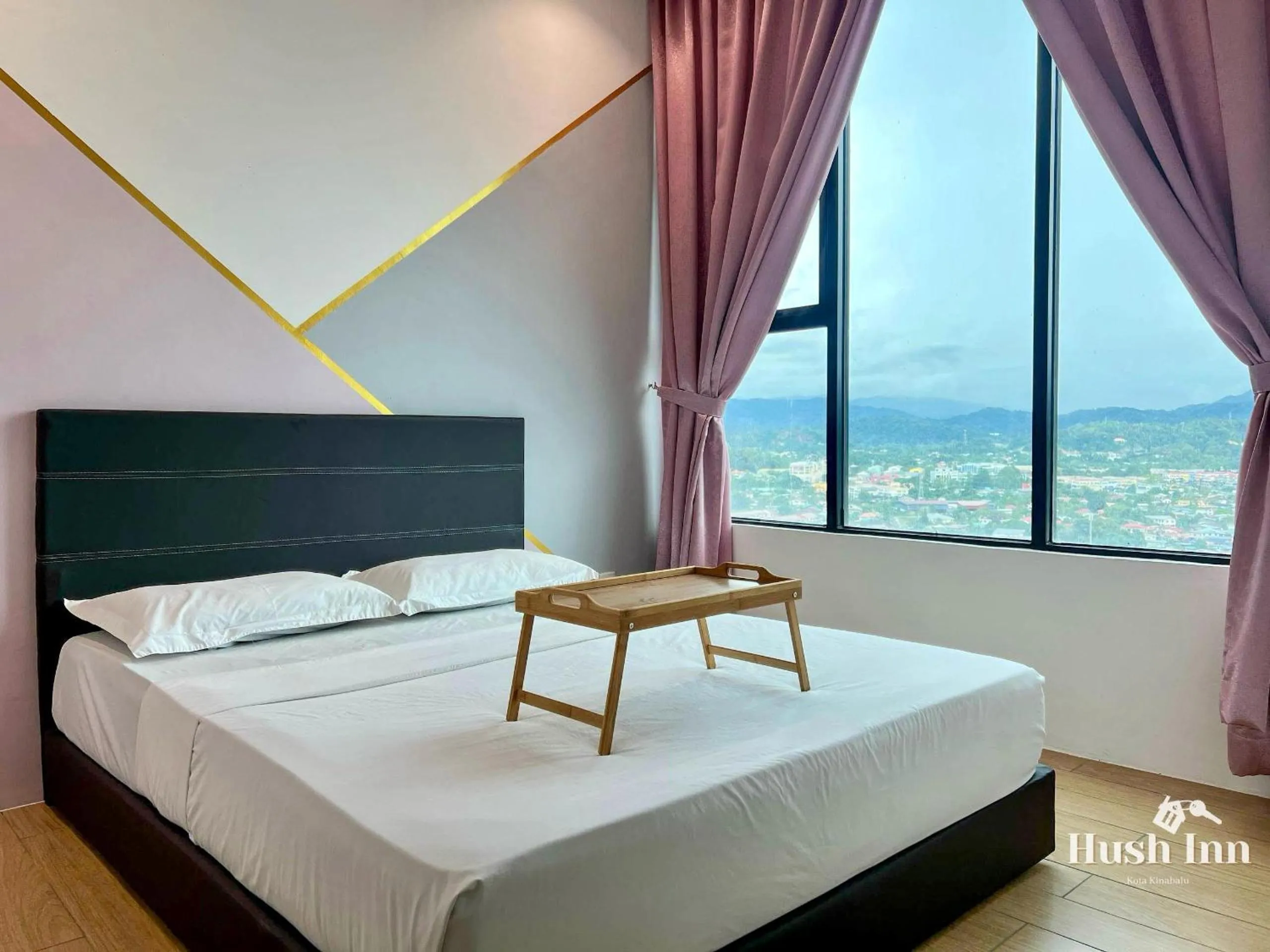 Bed in Hush Inn at ITCC Manhattan Suites