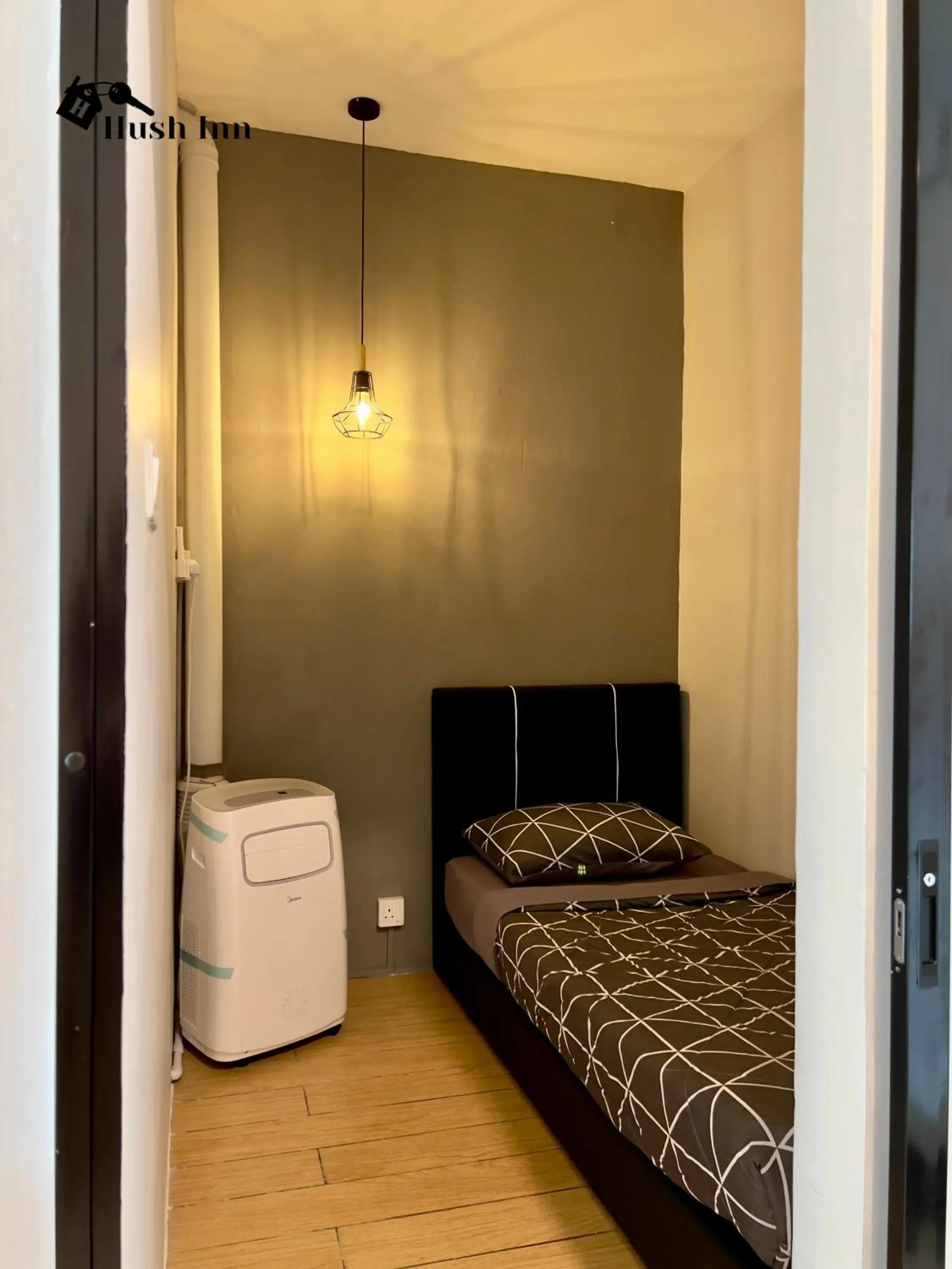 Bed in Hush Inn at ITCC Manhattan Suites