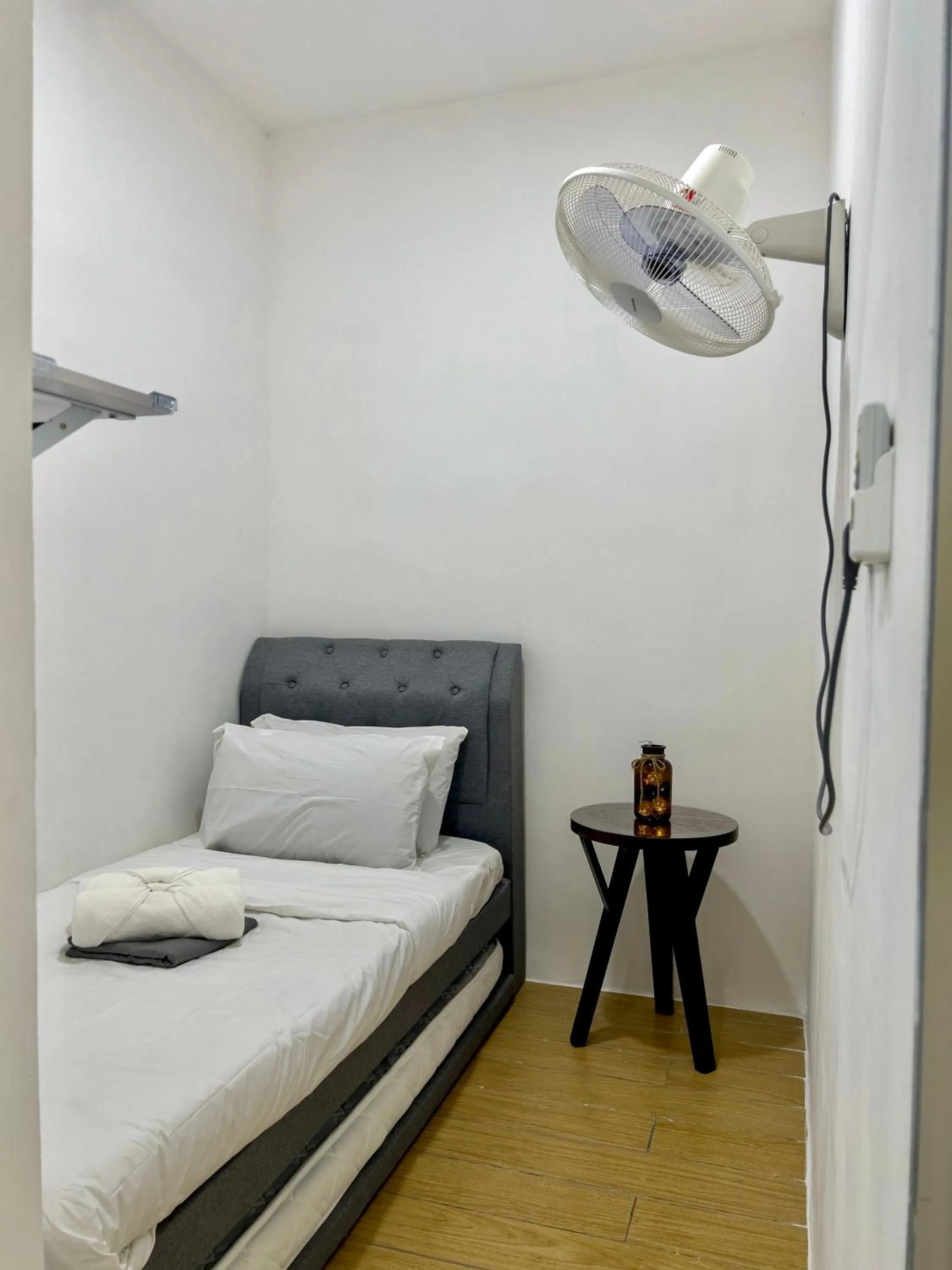 Bed in Hush Inn at ITCC Manhattan Suites