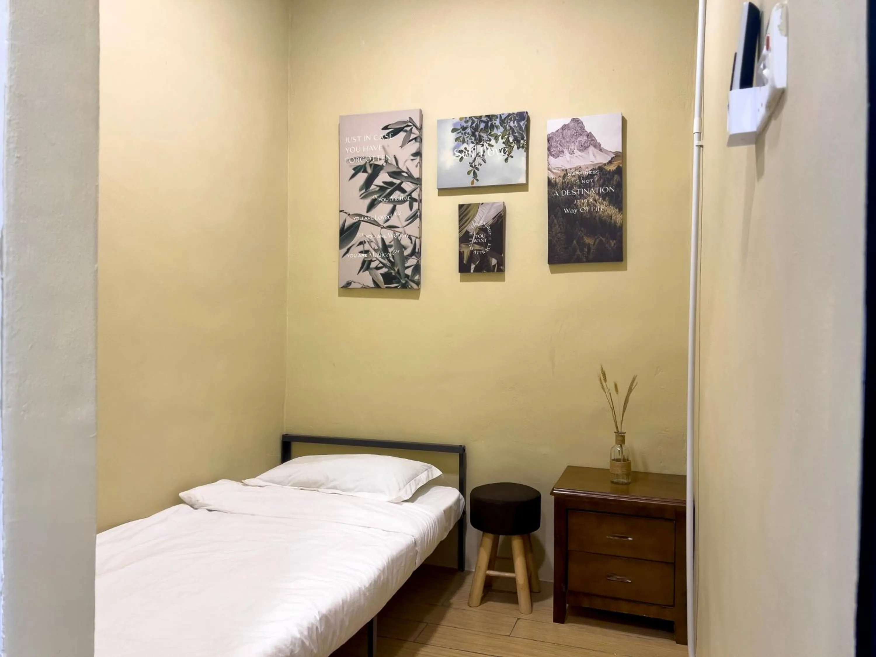 Bed in Hush Inn at ITCC Manhattan Suites