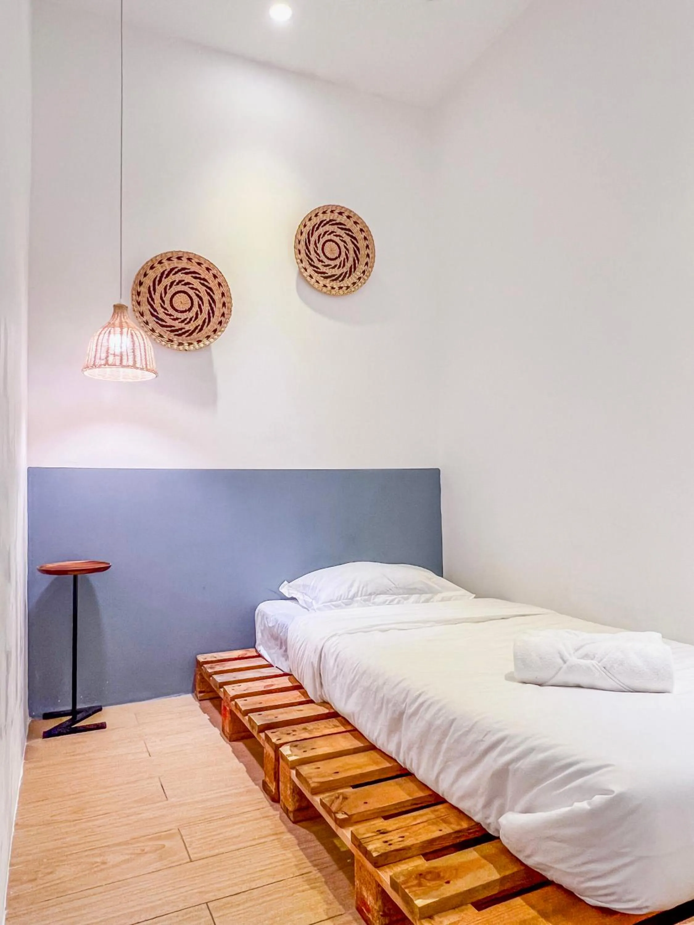 Bed in Hush Inn at ITCC Manhattan Suites