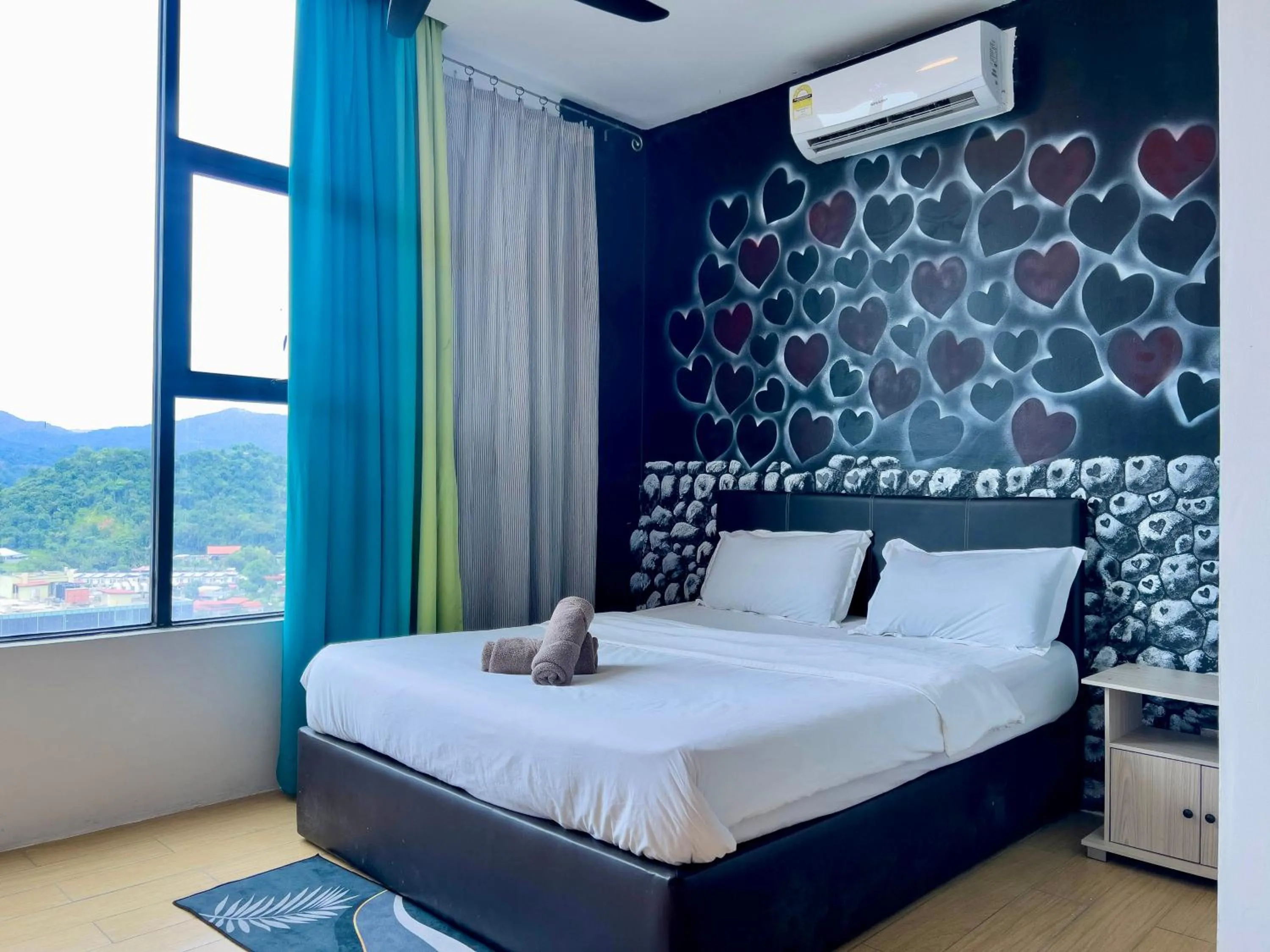 Bed in Hush Inn at ITCC Manhattan Suites