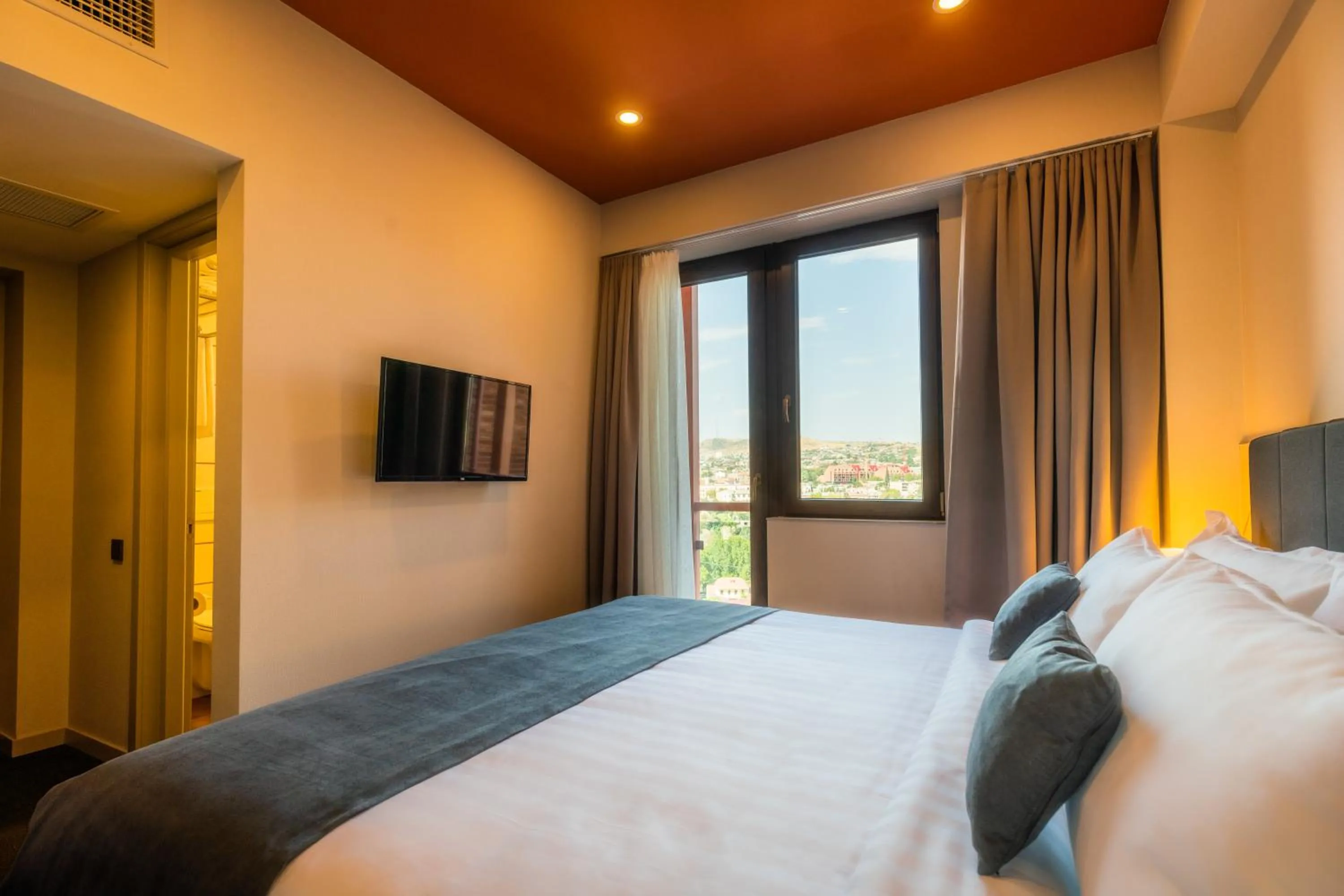 Bed in Reikartz King Tamar Tbilisi