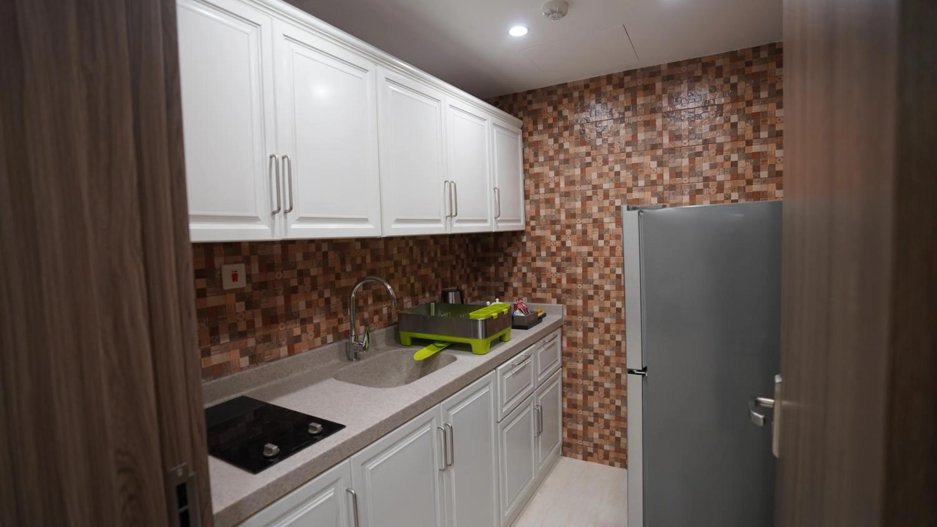 Kitchen or kitchenette in Rukn Mawasim Serviced Apartments