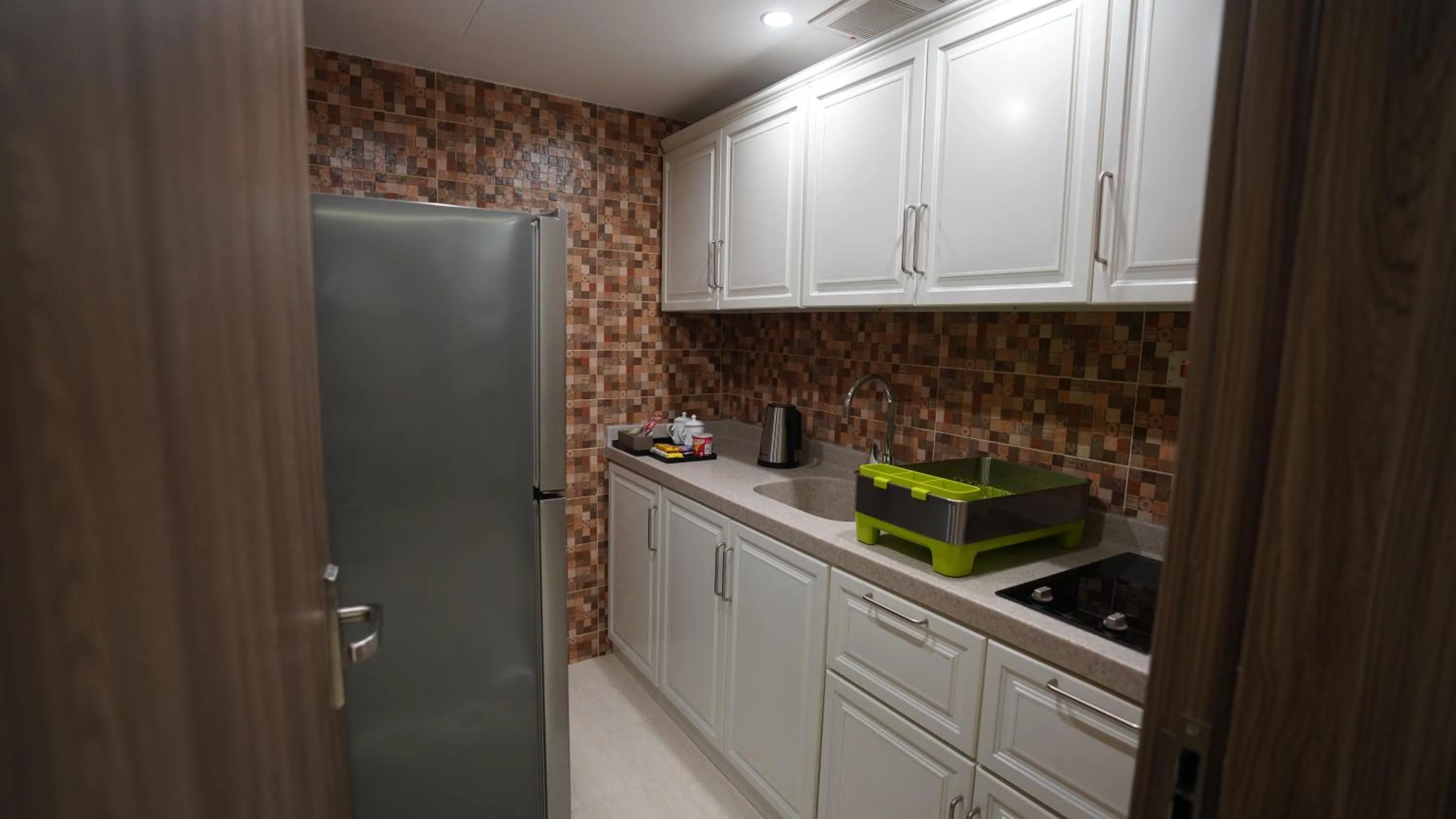 Kitchen or kitchenette in Rukn Mawasim Serviced Apartments