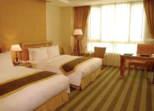 Bed in Kai Du Hotel Bed in Kai Du Hotel