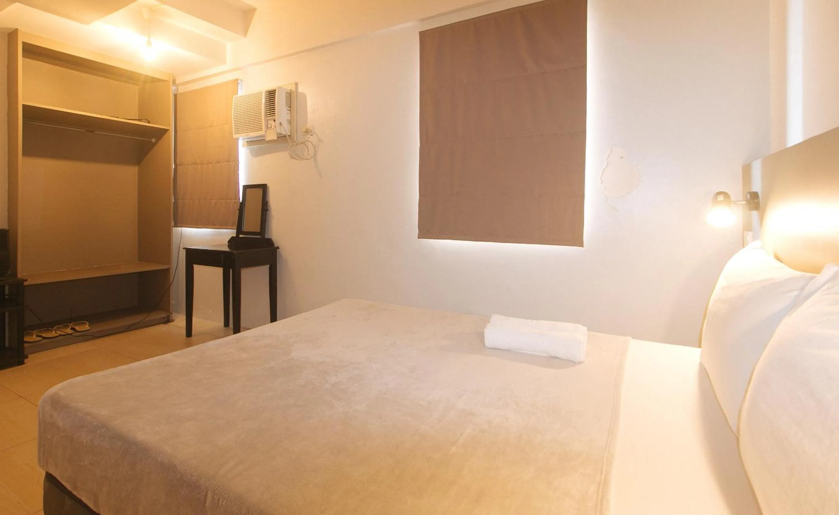 Bed in 59 Xavierville by RedDoorz