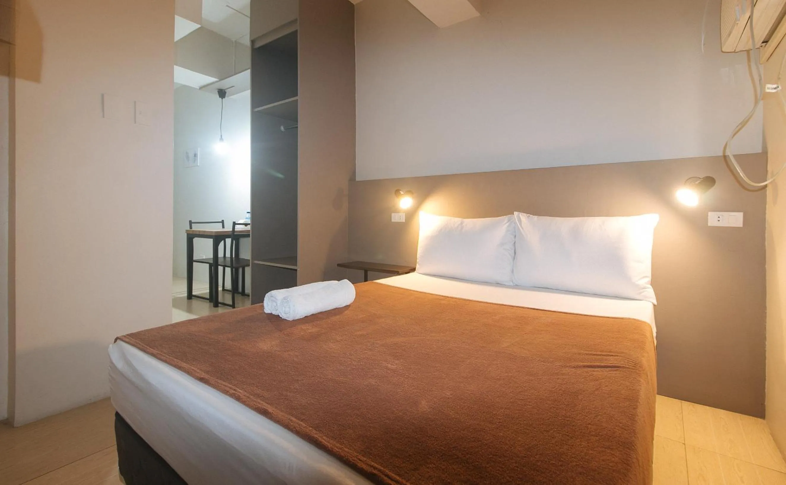 Bed in 59 Xavierville by RedDoorz