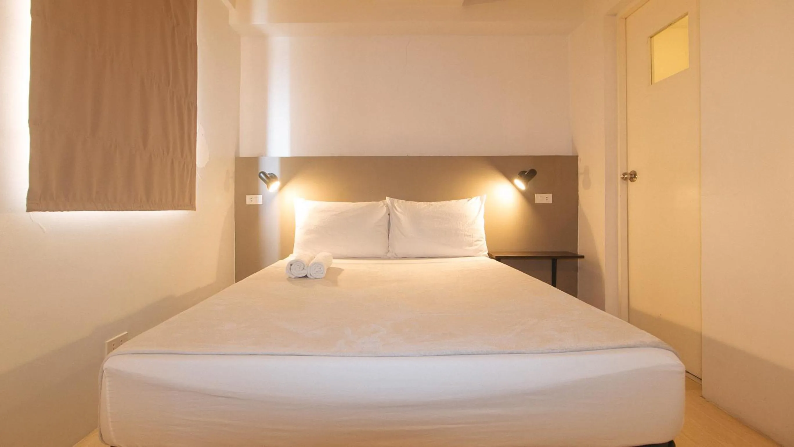 Bed in 59 Xavierville by RedDoorz