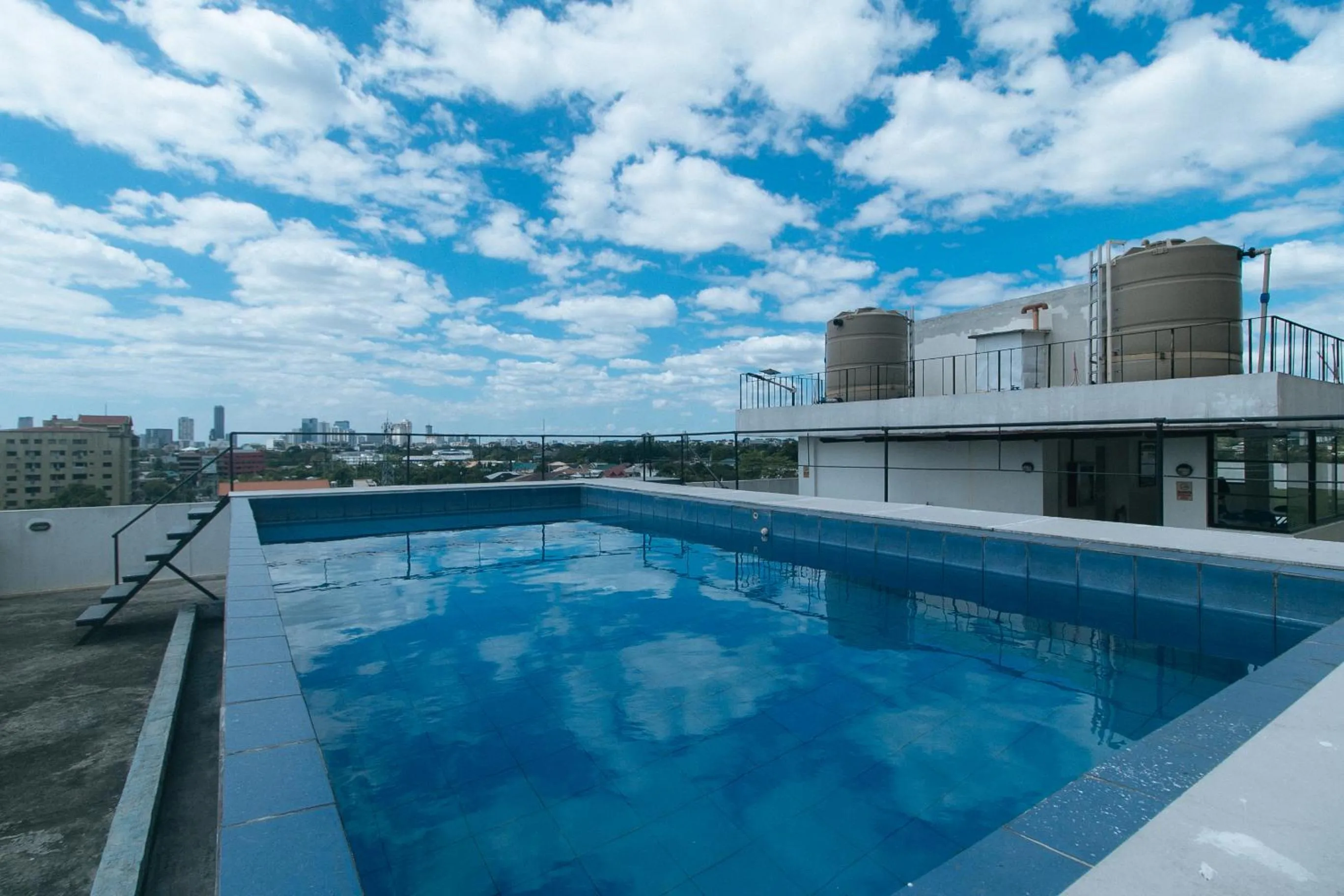 Pool view in 59 Xavierville by RedDoorz