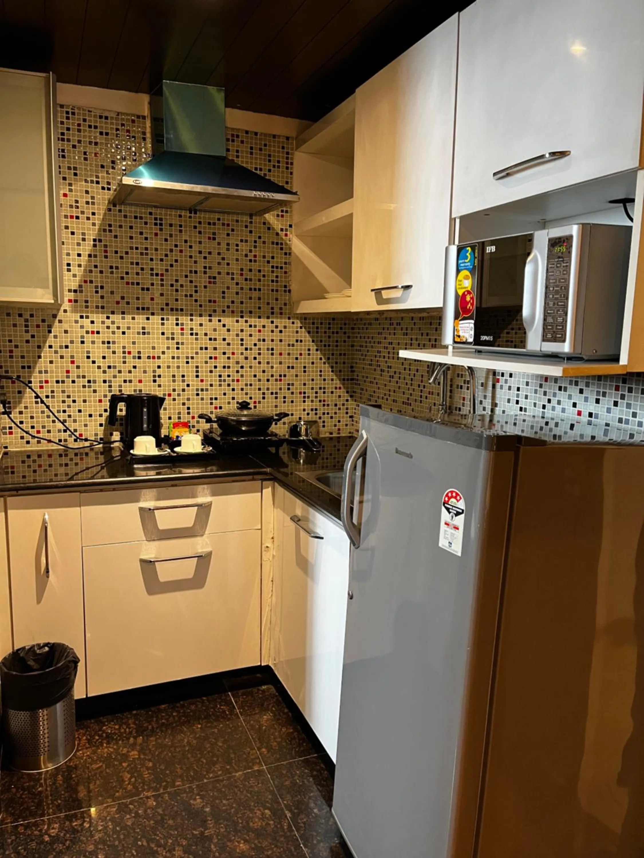 Kitchen or kitchenette in Yuhi Suites