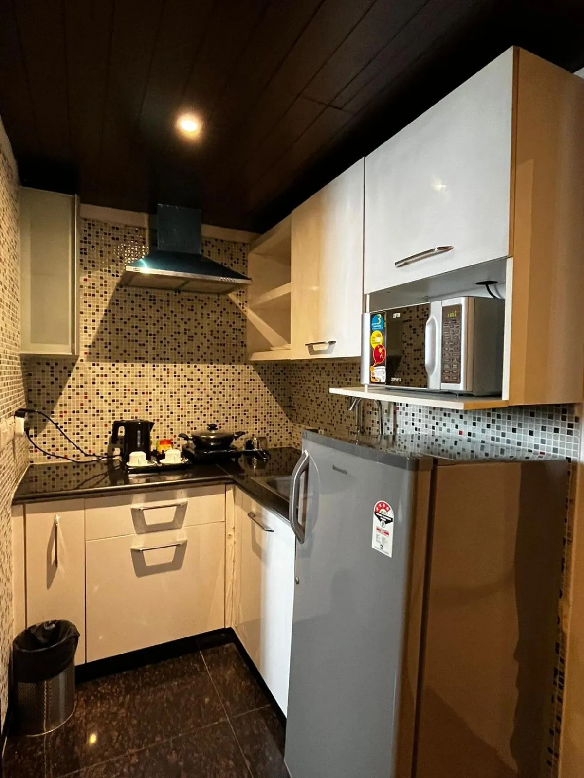 kitchen in Yuhi Suites