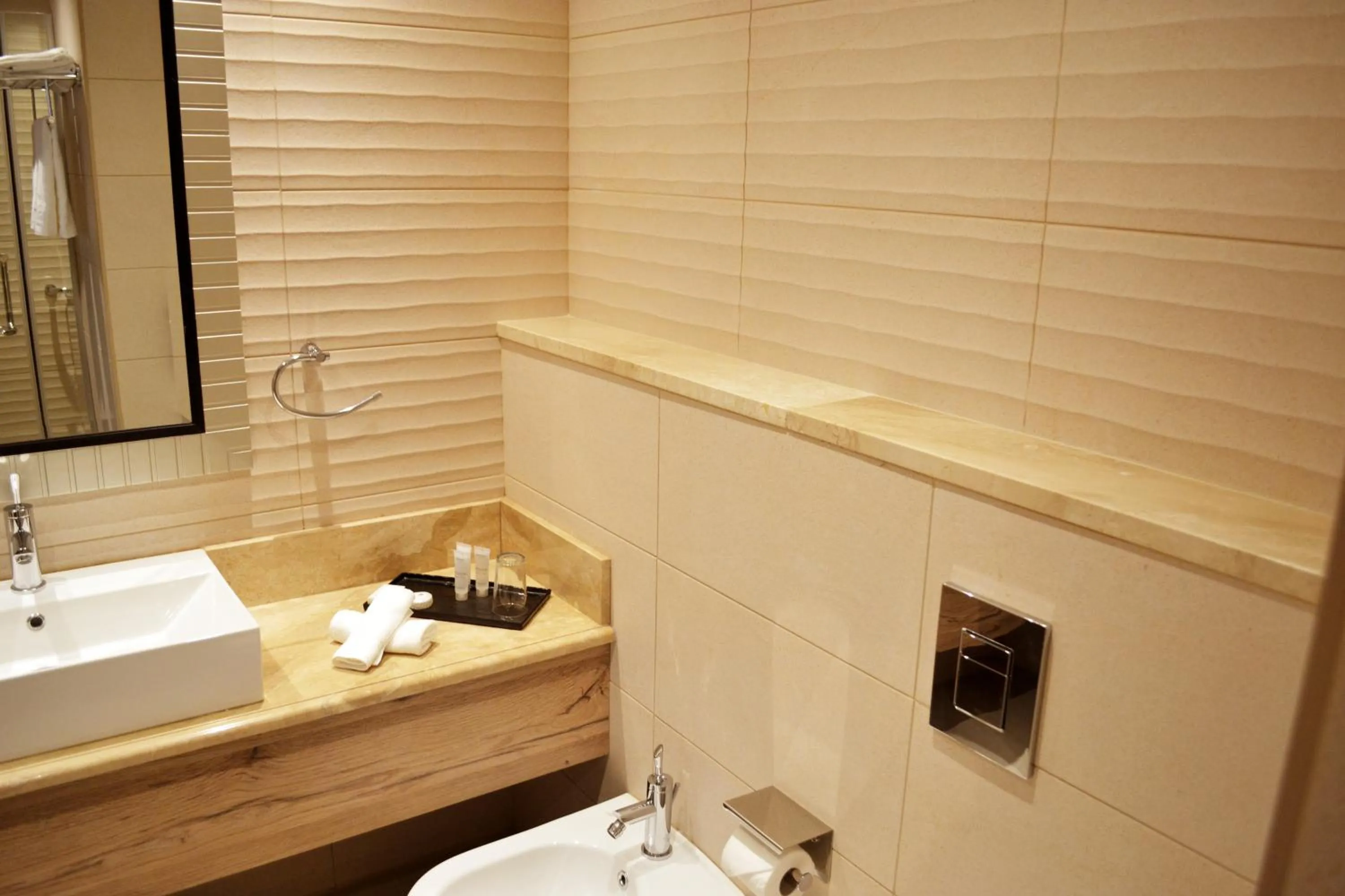 Bathroom in Ambassador, a Boutique Hotel