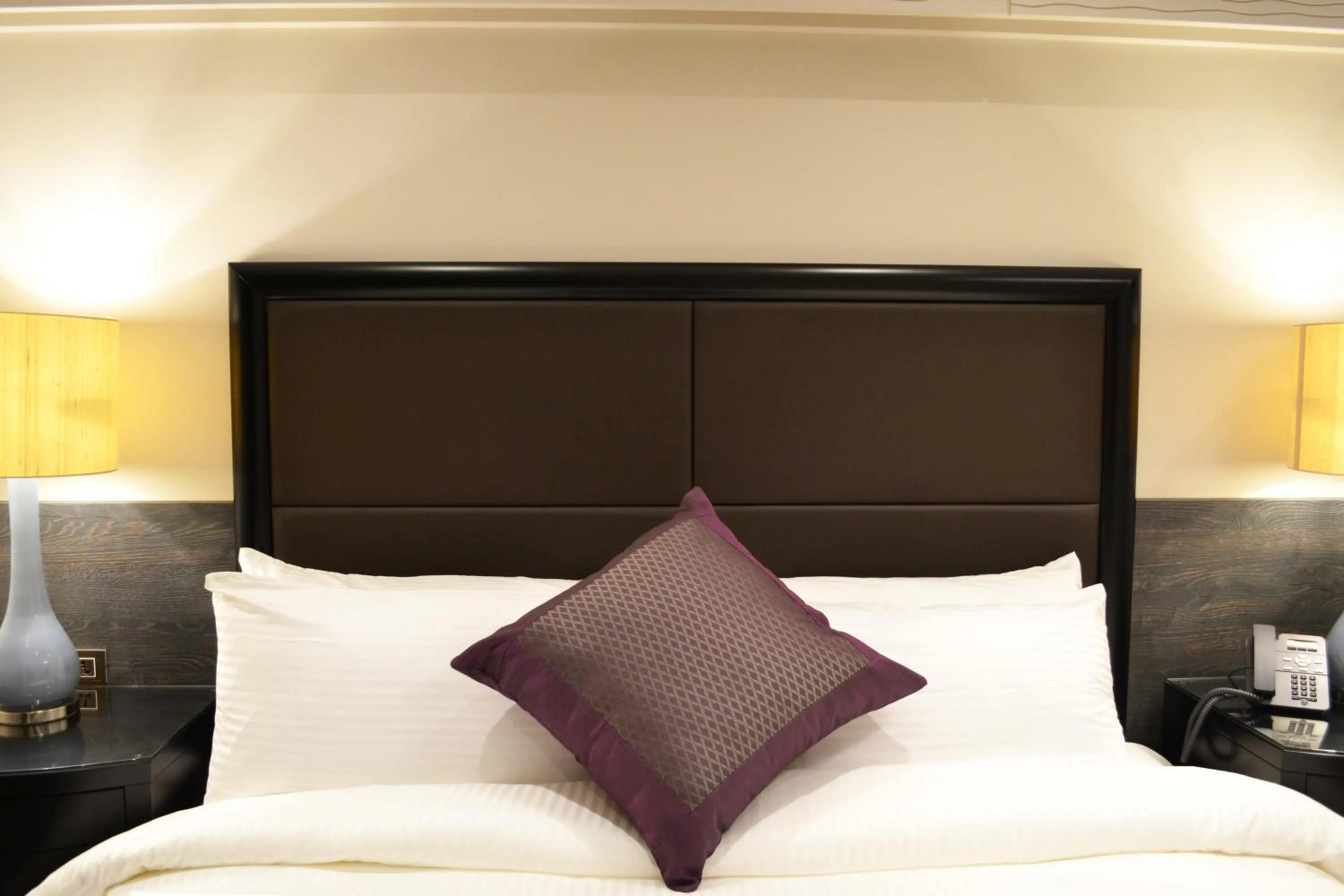 Bed in Ambassador, a Boutique Hotel